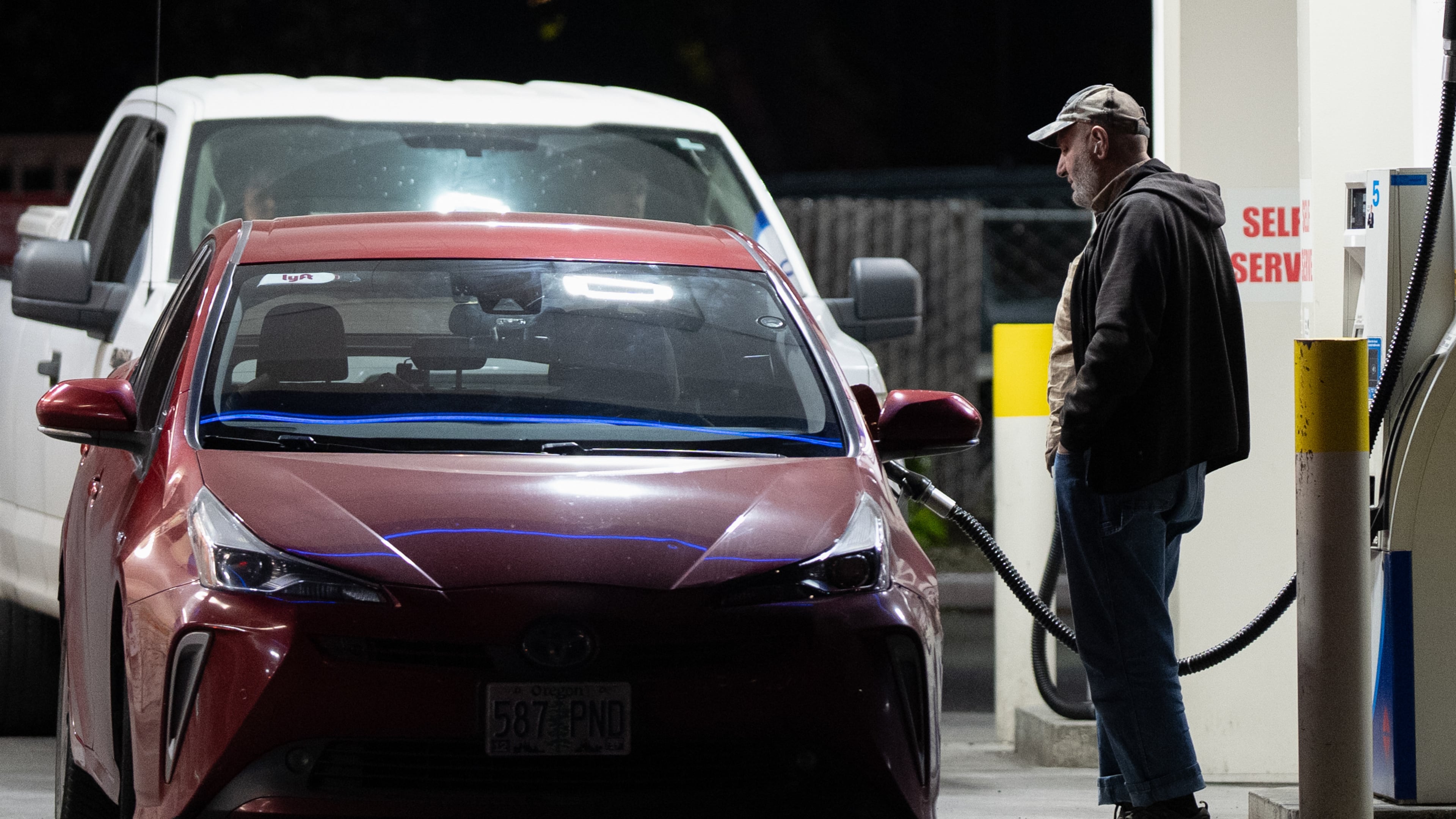 A person fills a tank with fuel at a gas station on Wednesday, May 6, 2026, in Portland, Ore. (AP Photo/Jenny Kane)