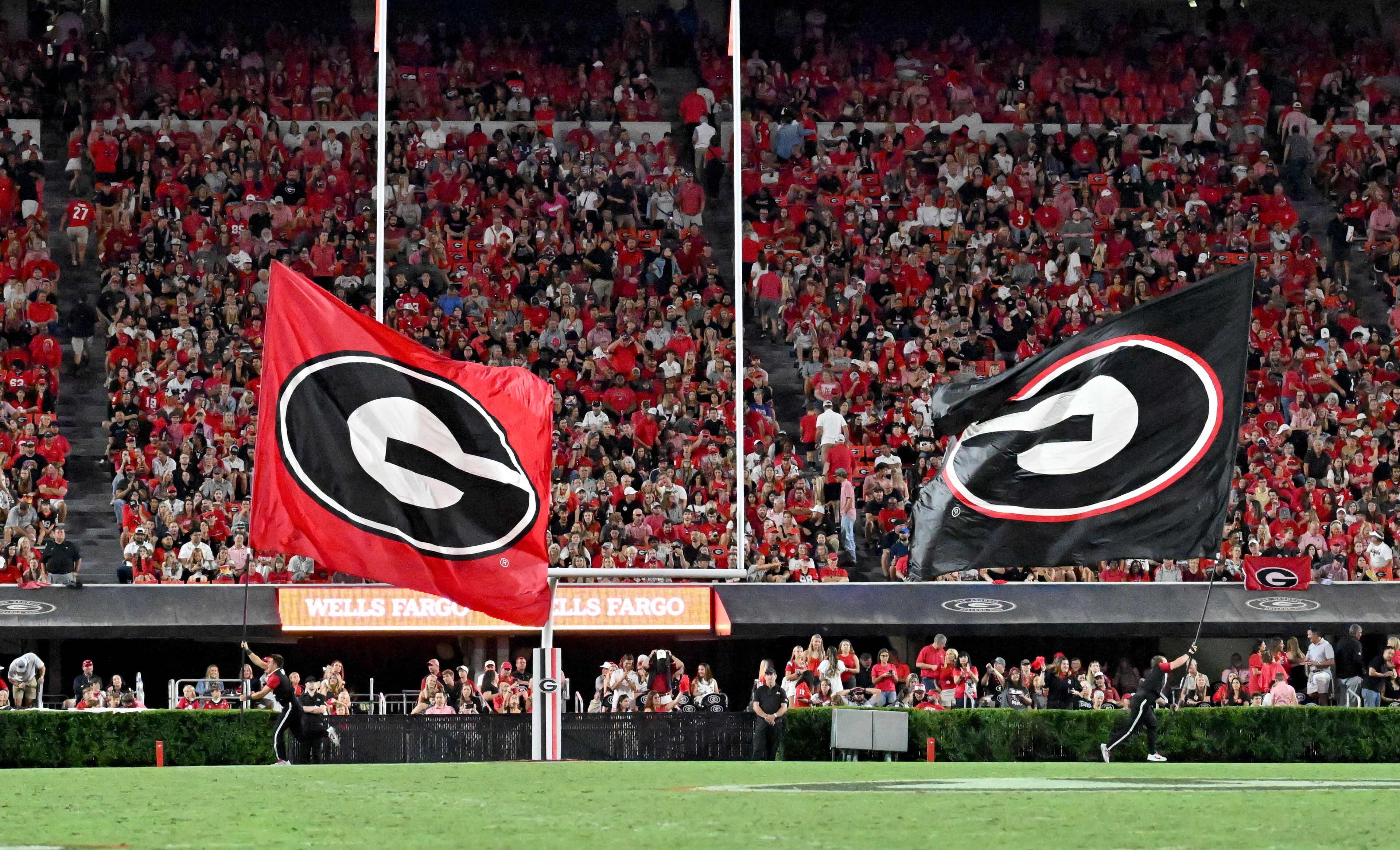 Georgia fans cheer after Georgia's quarterback Carson Beck (15) scored a touchdown during the second half in an NCAA football game against the UAB at Sanford Stadium, Saturday, September 23, 2023, in Athens. Georgia won 42-21 over UAB. (Hyosub Shin / Hyosub.Shin@ajc.com)