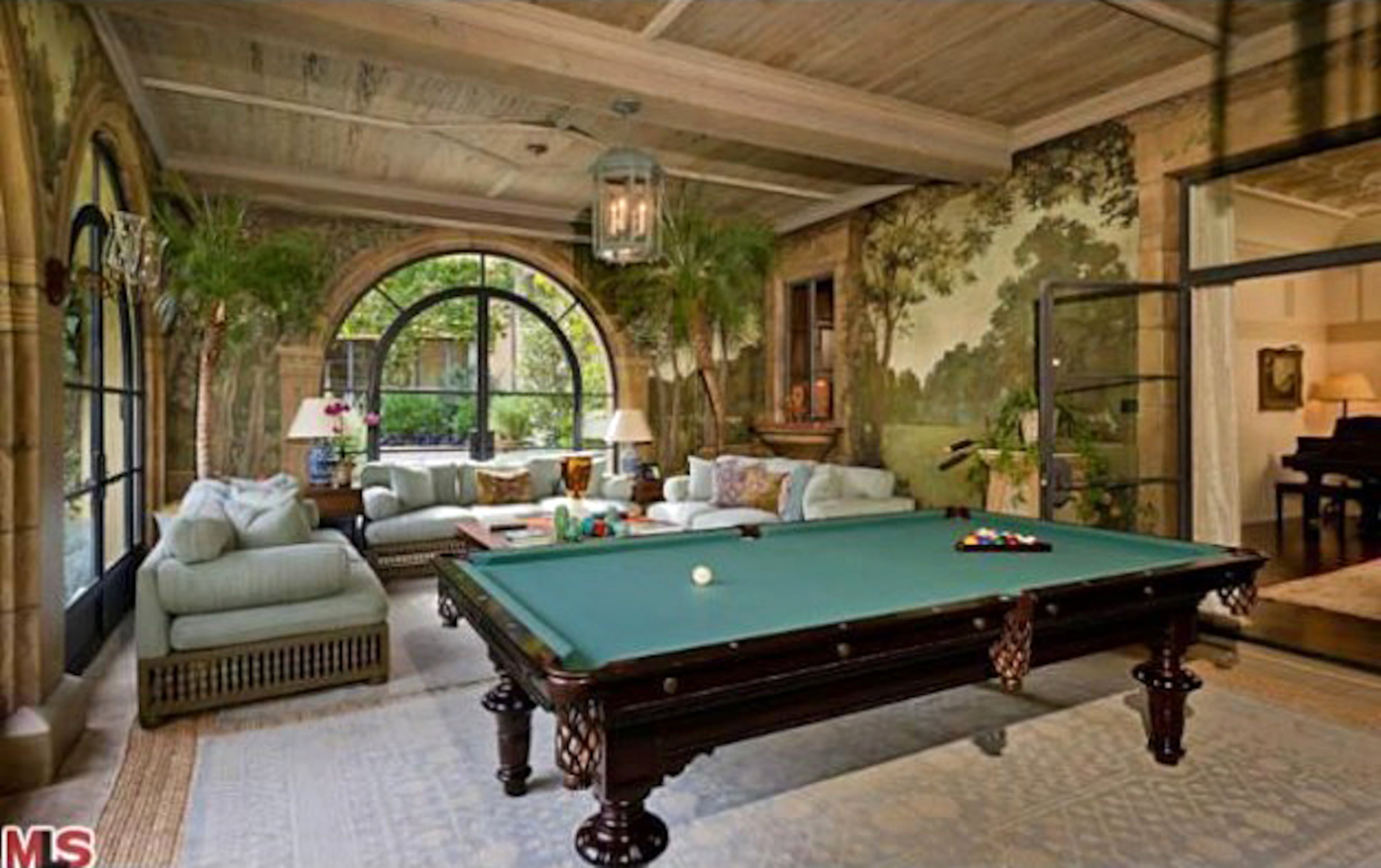 Take a peek inside Christina Aguilera's Beverly Hills mansion. The home, which Aguilera bought for $10.75 million in 2013, features six bedrooms, nine bathrooms, a master suite with a fireplace, a patio, an office, a spa bath, a screening room and wet bars. The property also includes a pool and spa. For more information, visit http://www.toptenrealestatedeals.com/homes/weekly-ten-best-home-deals/2013/5-14-2013/.