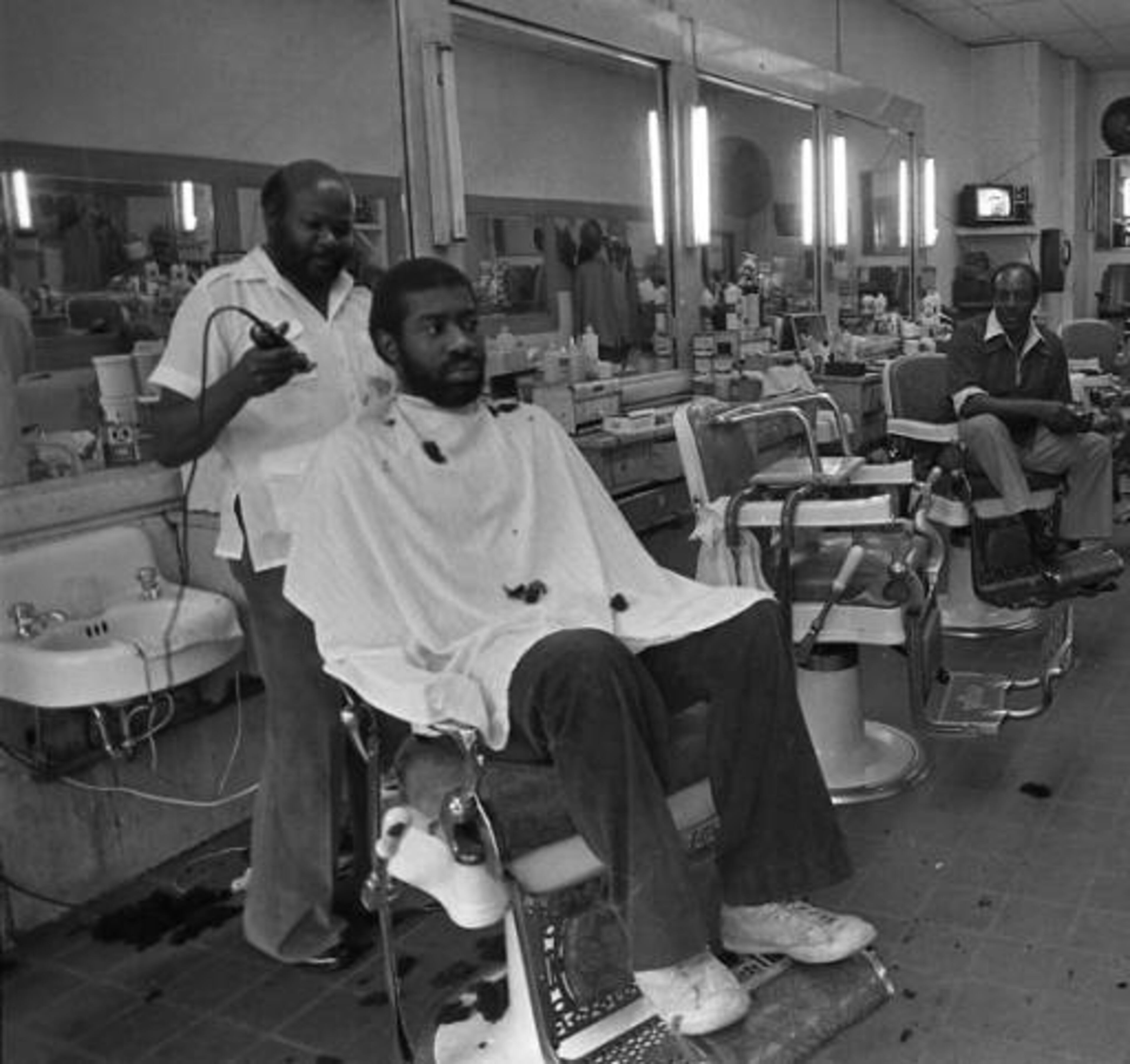 Customers at Silver Moon barbershop in November 1981. The shop closed in 2012 after being open for 108 years. Photo: Nick Arroyo / AJC. »» SEE MORE FLASHBACK FOTOS FROM THE AJC ARCHIVES.