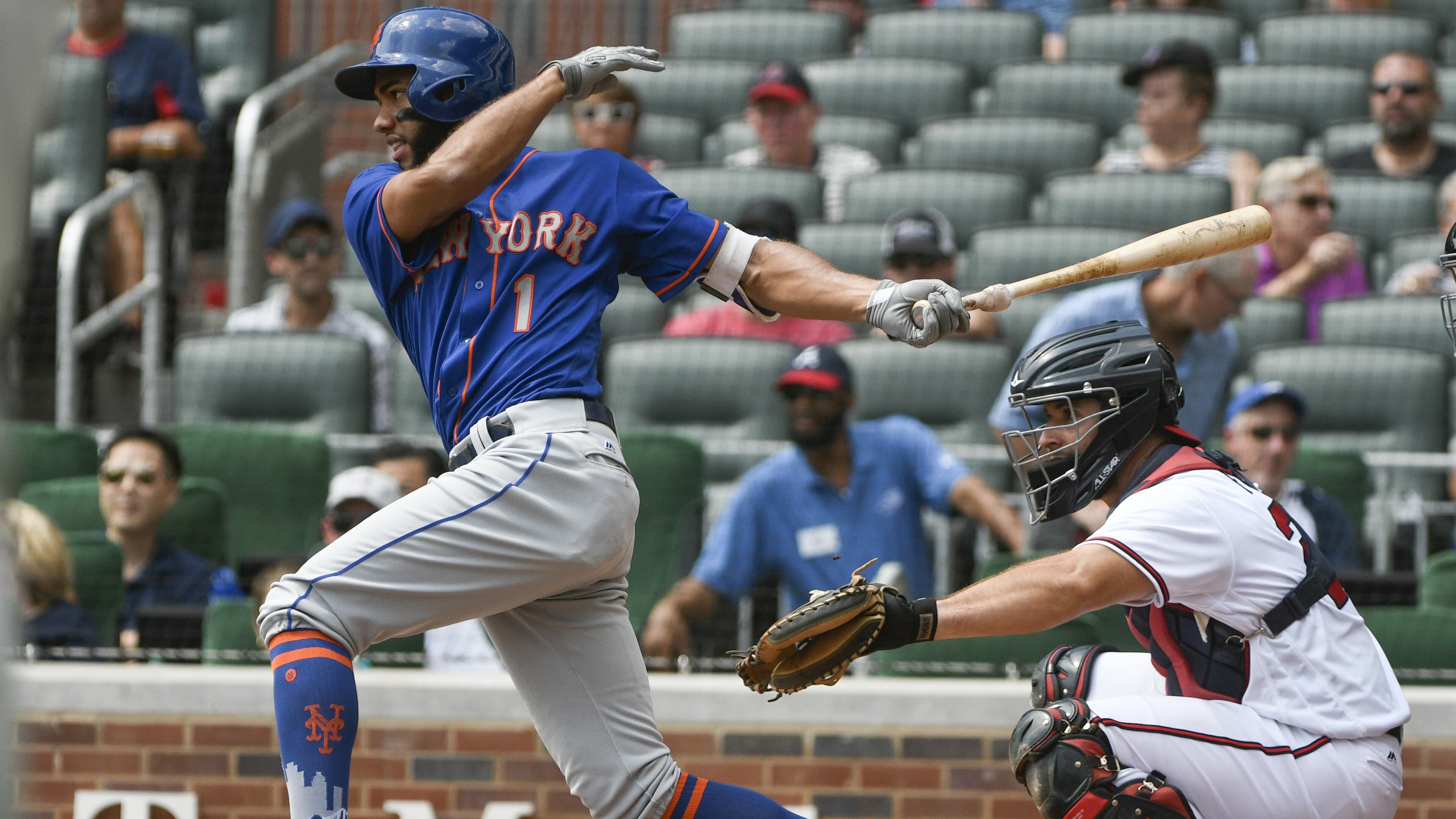 ATLANTA, GA - SEPTEMBER 17: Amed Rosario #1 of the New York Mets hits a ground ball to second base to allow Jose Reyes to score against the Atlanta Braves in the first inning at SunTrust Park on September 17, 2017 in Atlanta, Georgia. (Photo by John Amis/Getty Images)