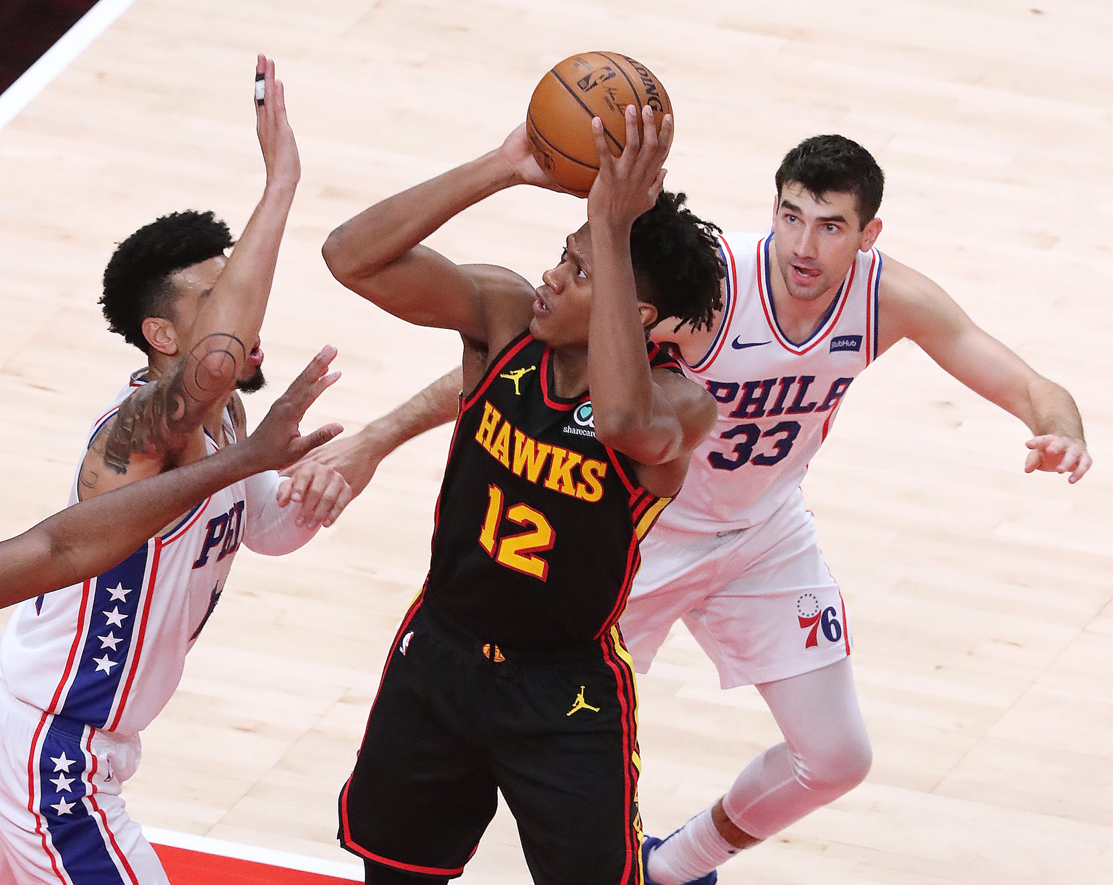 011121 Atlanta: Atlanta Hawks forward De’Andre Hunter shoots for two against the Philadelphia 76ers in a NBA basketball game on Monday, Jan. 11, 2021, in Atlanta. Curtis Compton / Curtis.Compton@ajc.com”