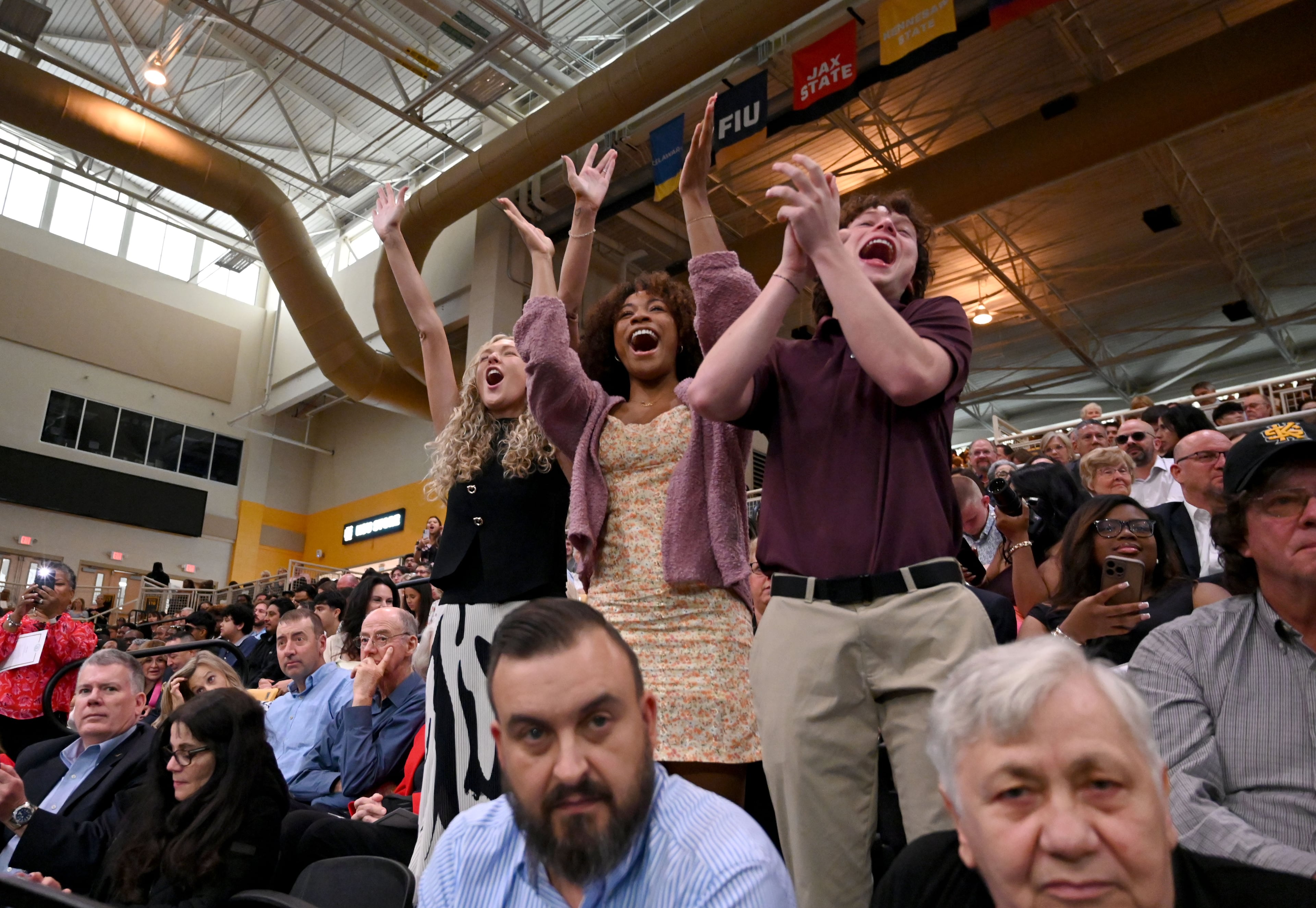 Sometimes, family and friends are just as excited as the graduate when they get their diploma. (Hyosub Shin/AJC)