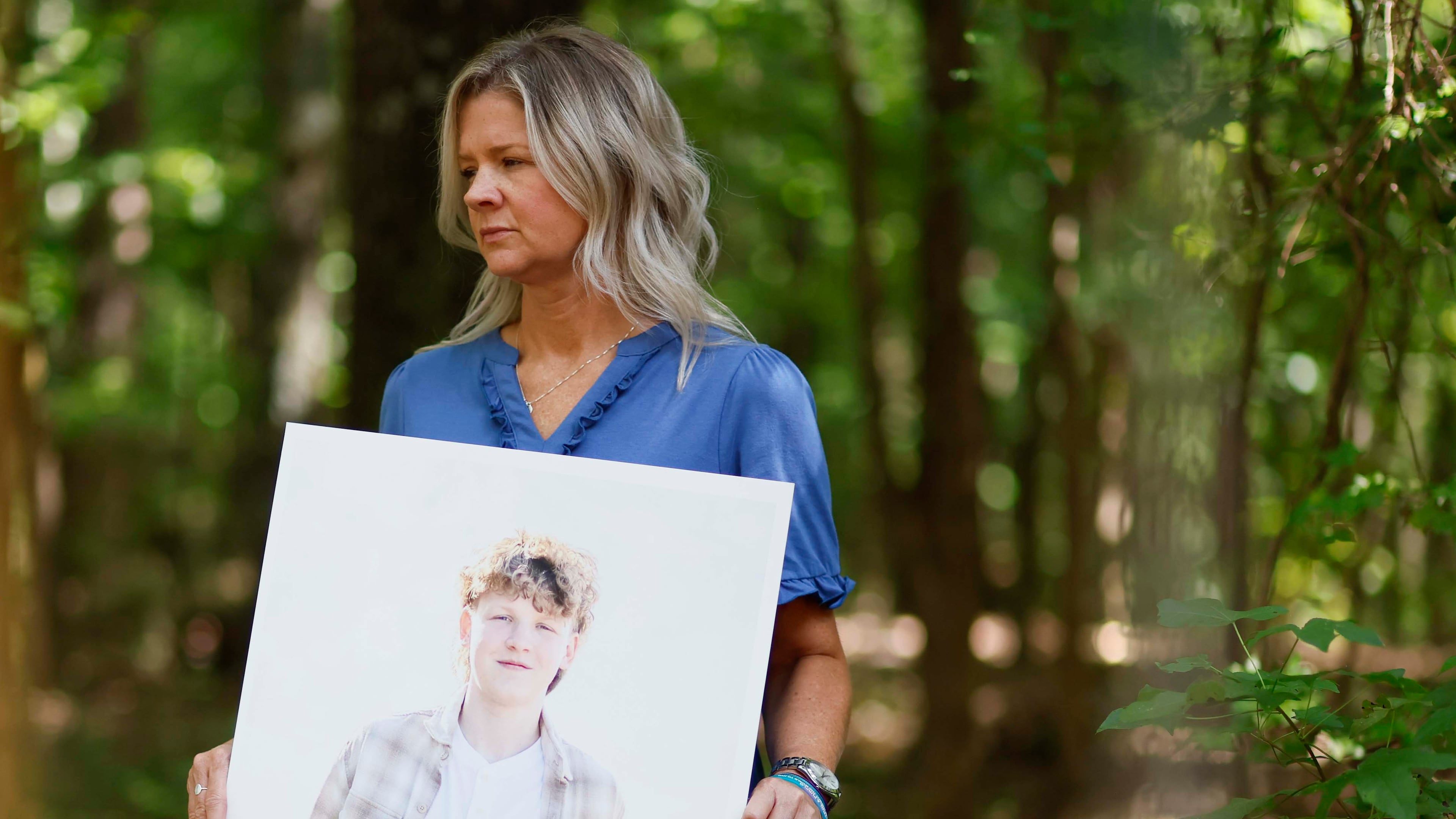 Ashley Worthey holds a portrait of her son, Mason Worthey, at her home in Good Hope, Ga., on Sunday, Aug. 9, 2026. She lost her 17-year-old son on March 6. As Suicide Prevention Month approaches, Ashley shares her story to support other families. (Miguel Martinez/AJC)