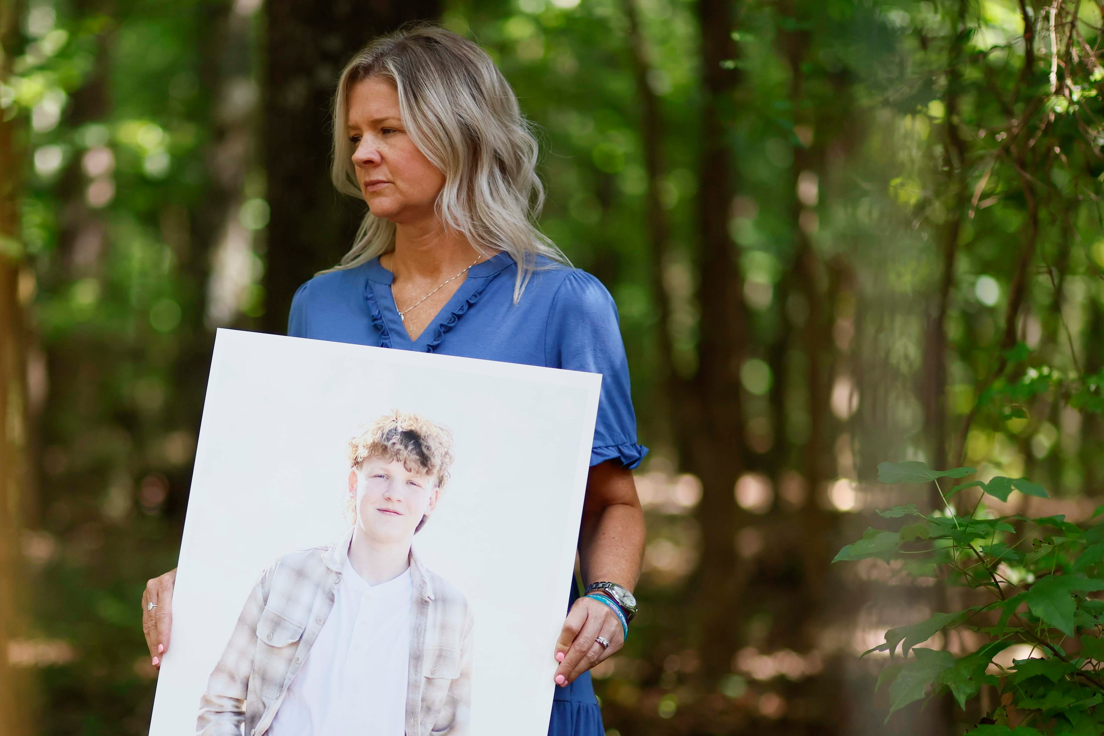 Ashley Worthey holds a portrait of her son, Mason Worthey, at her home in Good Hope, Ga., on Sunday, Aug. 9, 2026. She lost her 17-year-old son on March 6. As Suicide Prevention Month approaches, Ashley shares her story to support other families. (Miguel Martinez/AJC)