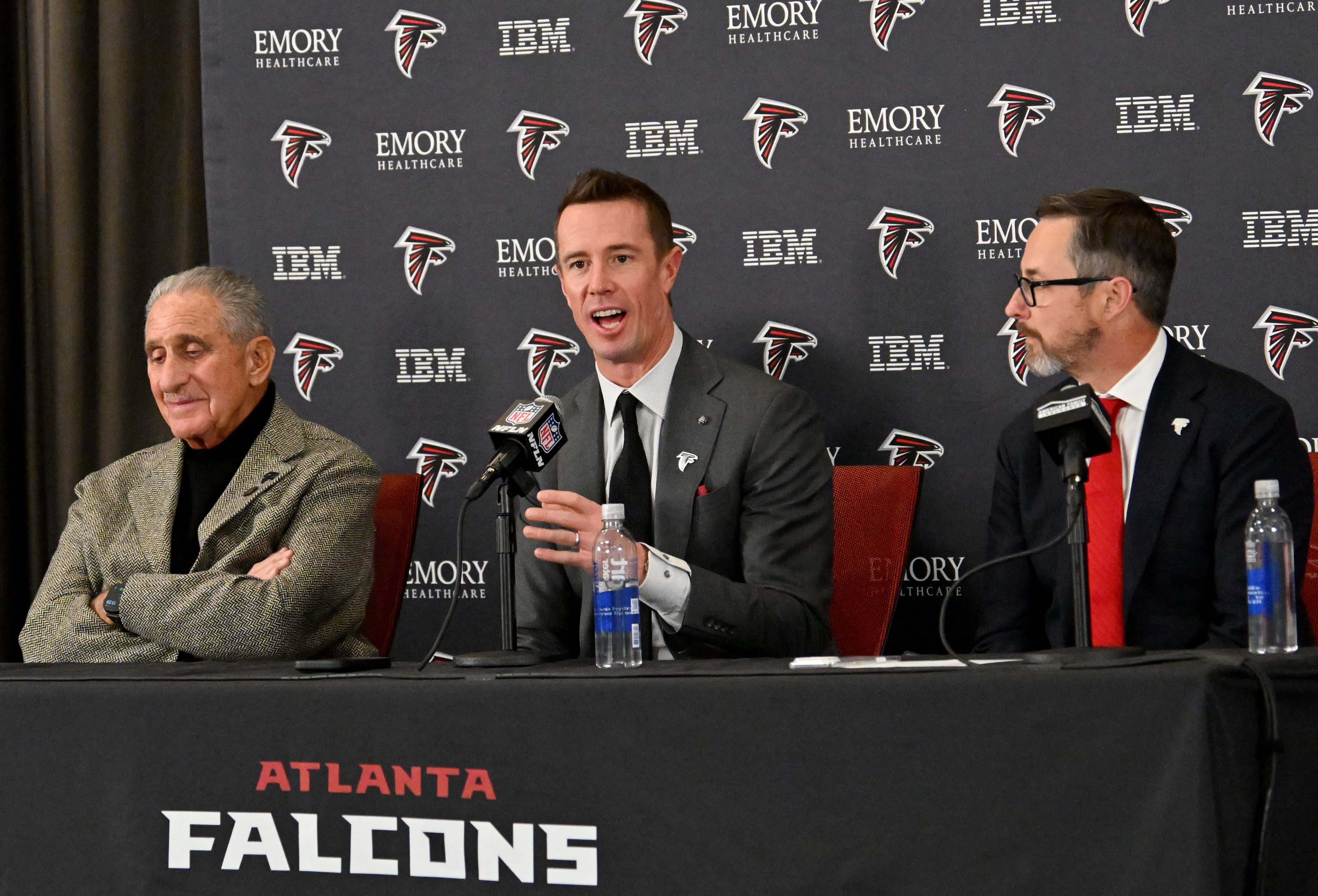 New Falcons president of football Matt Ryan speaks as Arthur M. Blank (left) and CEO Greg Beadles sit next him during a news conference to introduce new Falcons president of football Matt Ryan, Tuesday, Jan. 13, 2026, in Flowery Branch. (Hyosub Shin/AJC)