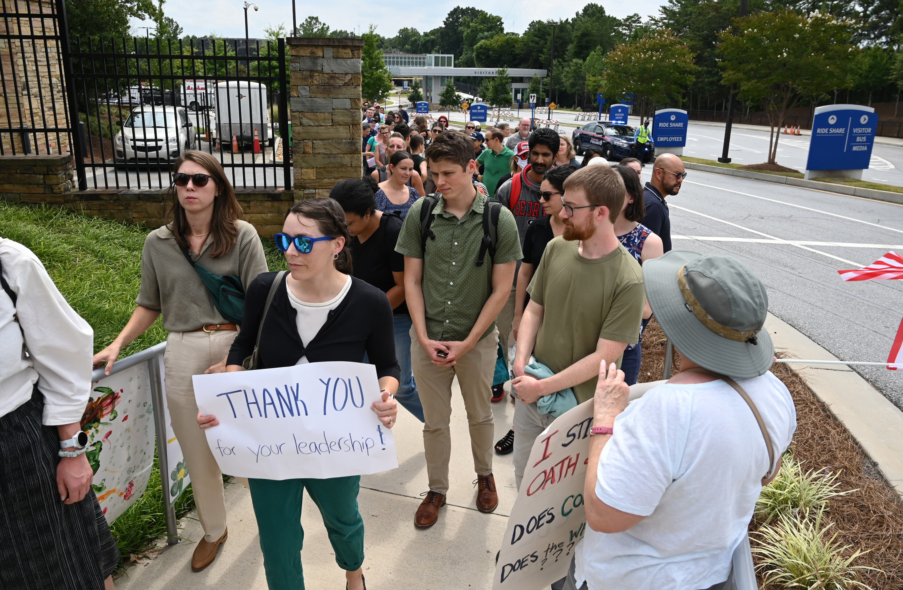CDC workers walk off to rally for departing leaders at the Centers for Disease Control and Prevention outside the CDC headquarters, Thursday, August 28, 2025, in Atlanta. (Hyosub Shin/AJC)