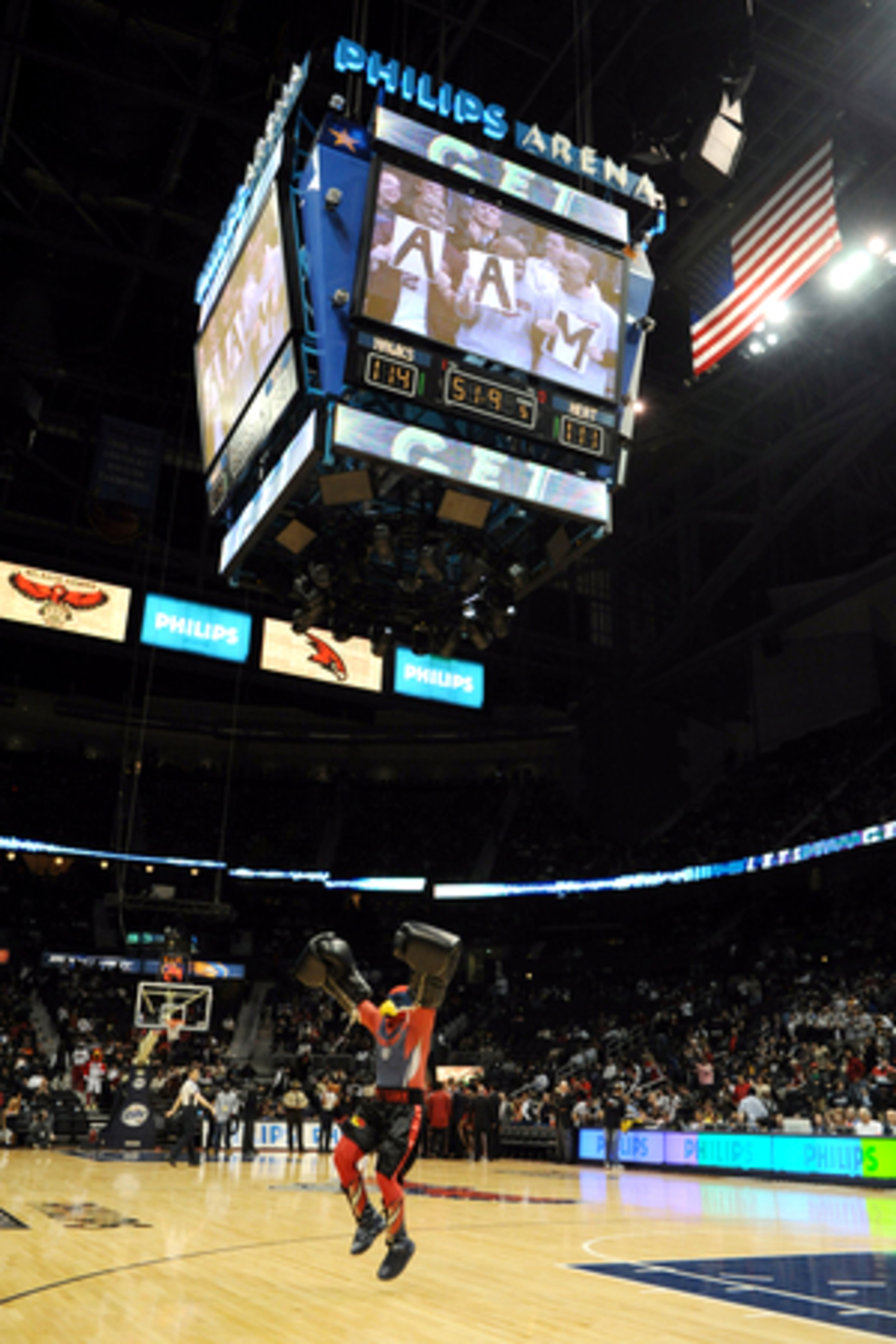 Harry the Hawk tries to get the crowd fired up before the start of the protested game Saturday at Philips Arena. Atlanta and Miami replayed the final 51.9 seconds from their Dec. 19 game.