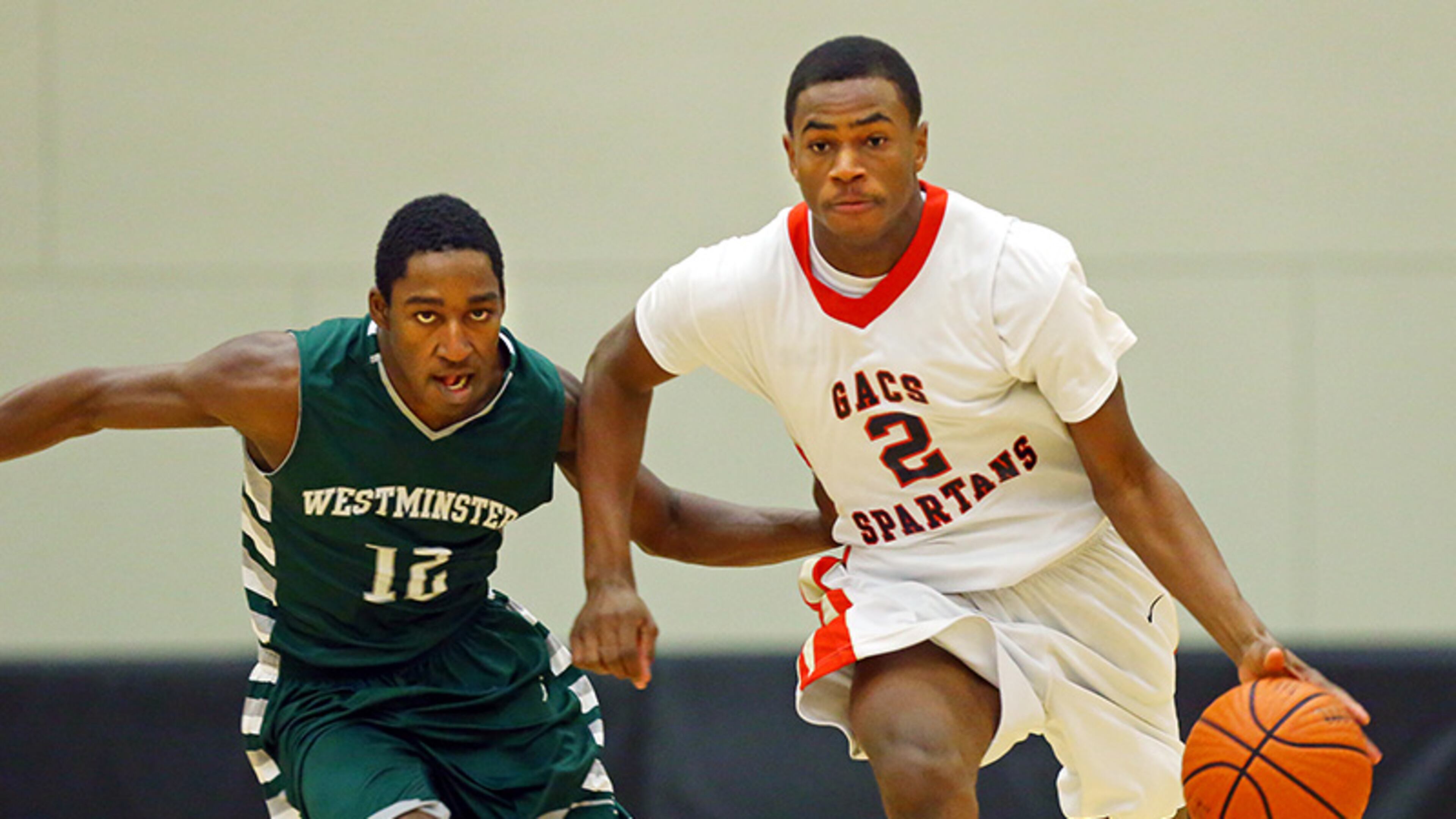 011414 NORCROSS: GAC Spartans ERic Jamison breaks away from Westminster Wildcats Marquavious Strozier during the first half of their high school basketball game at Greater Atlanta Christian High School on Tuesday, Jan. 14, 2014, Norcross . CURTIS COMPTON / CCOMPTON@AJC.COM Greater Atlanta's Eric Jamison breaks away from Westminster's Marquavious Strozier Tuesday in Norcross. (Curtis Compton / AJC)
