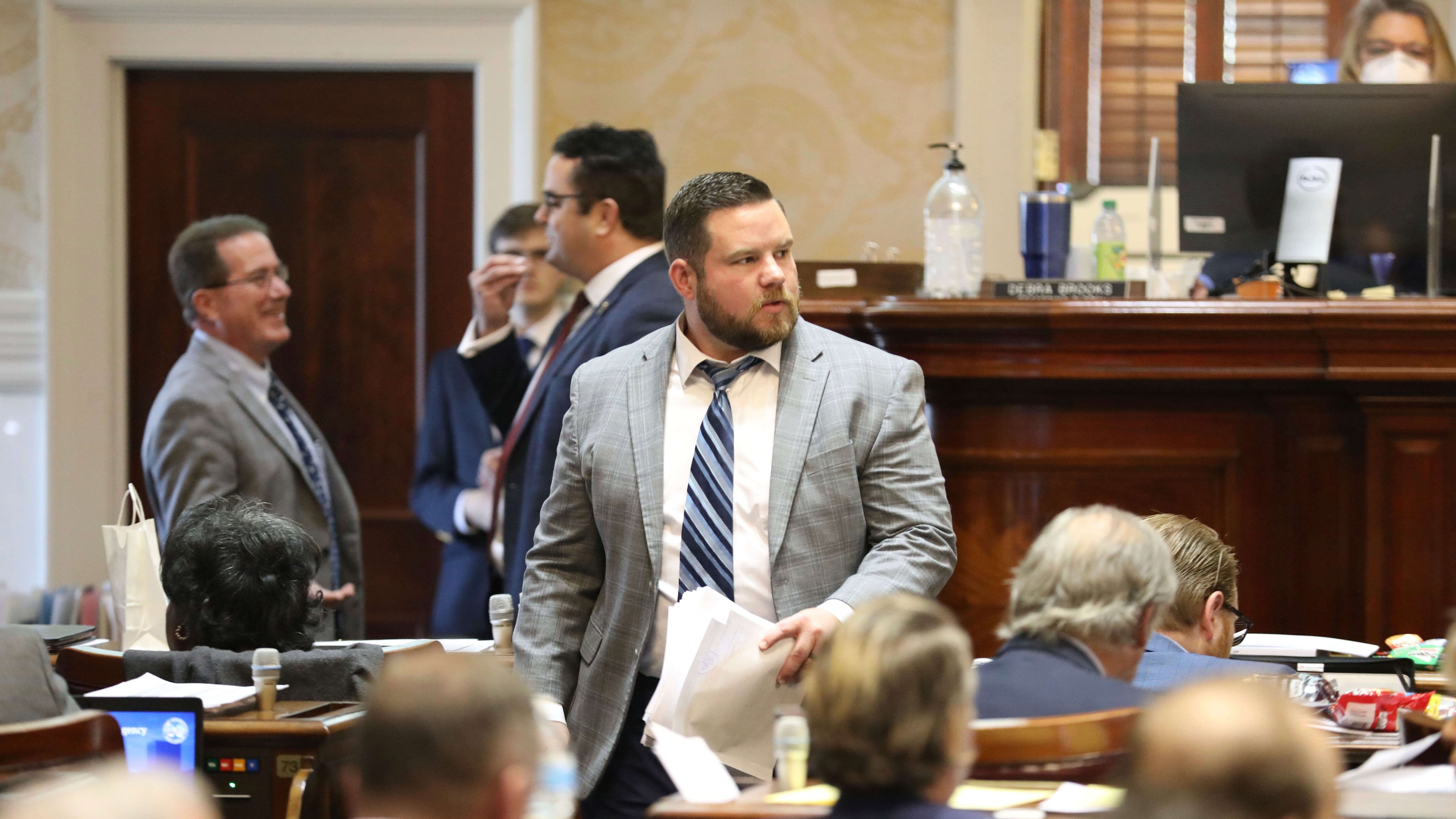 FILE - South Carolina Rep. RJ May, R-West Columbia, walks down the aisle of the House on Tuesday, March 14, 2023, in Columbia, South Carolina. (AP Photo/Jeffrey Collins,File)