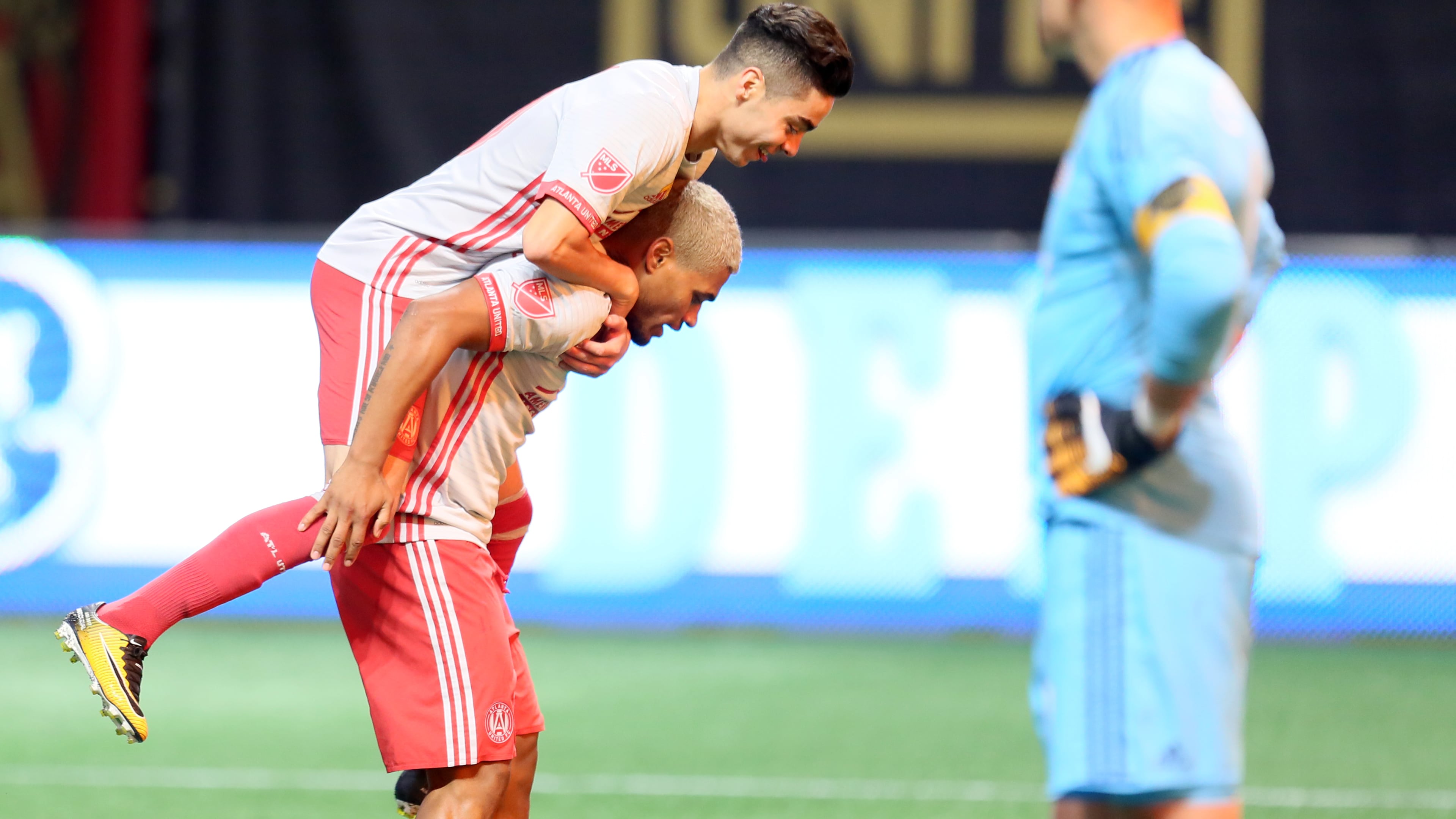 September 13, 2017 Atlanta: Atlanta United's Miguel Almiron jumps onto Josef Martinez after scoring a penalty kick for the second goal against New England on Wednesday at Mercedes-Benz Stadium.