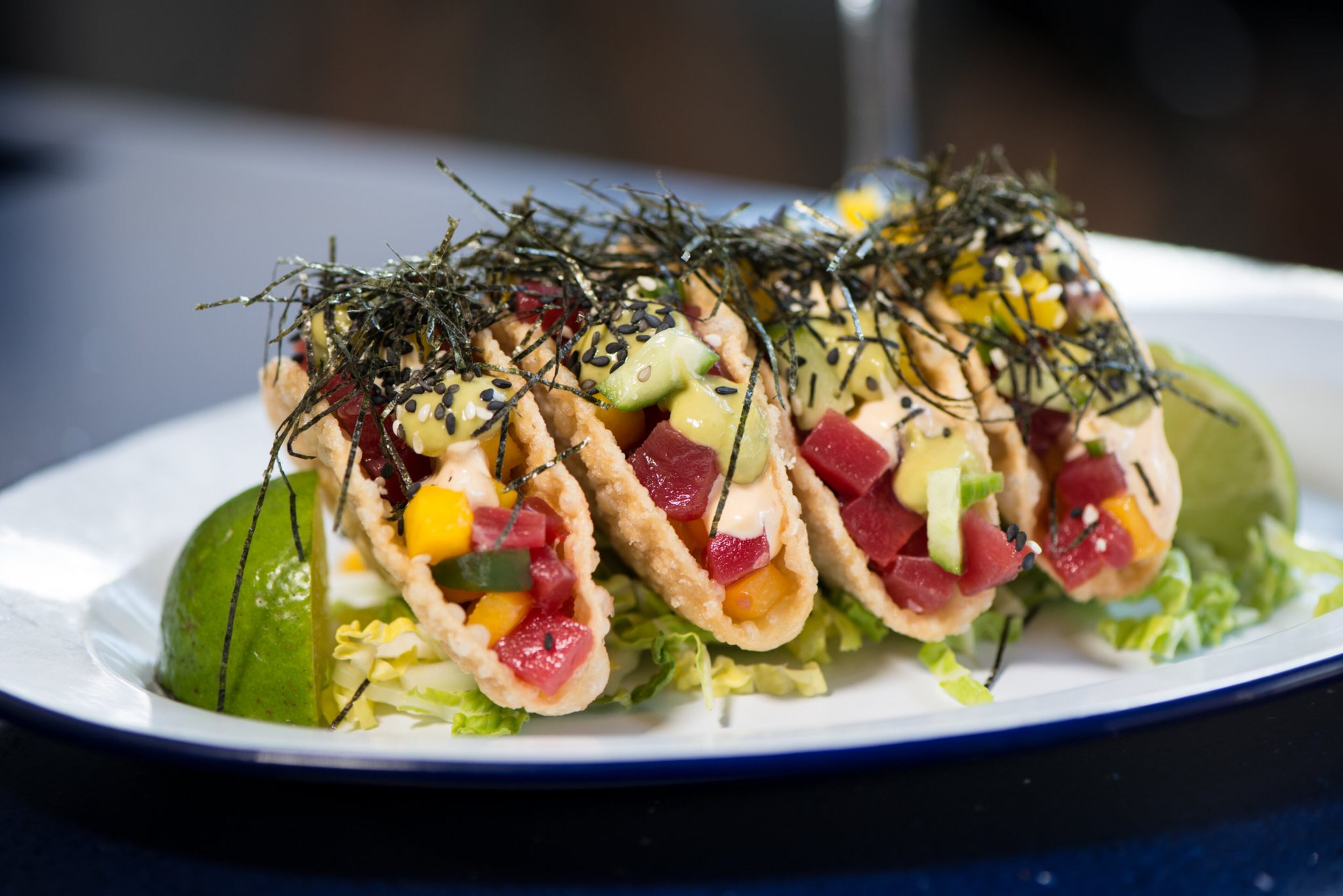 Whiskey Bird Hawaiian Tuna tacos with cucumber, mango, and avocado cream. Photo credit- Mia Yakel.