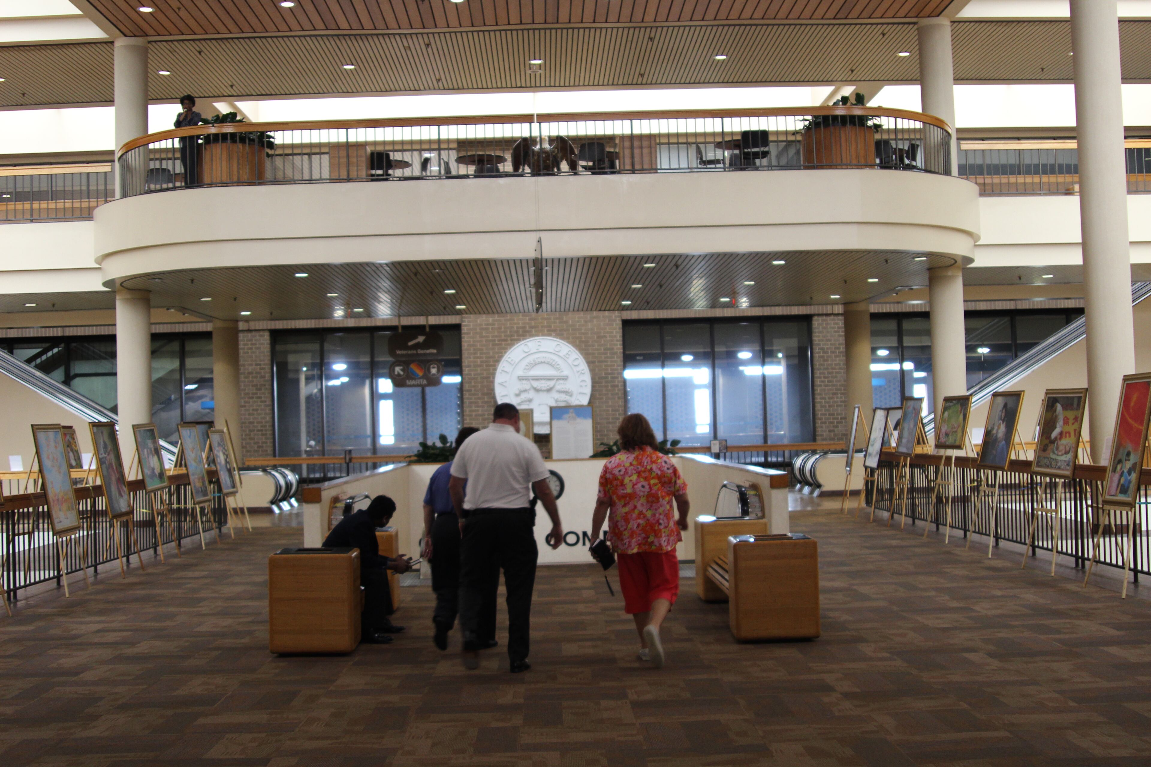 A series of paintings depicting the persecution of the Falun Gong religious group in China has been on display in the James "Sloppy" Floyd Veteran Memorial Building since May 2 in Atlanta. The group is against the Chinese government, which state officials have sought to build economic ties with. The display will come down earlier than planned.