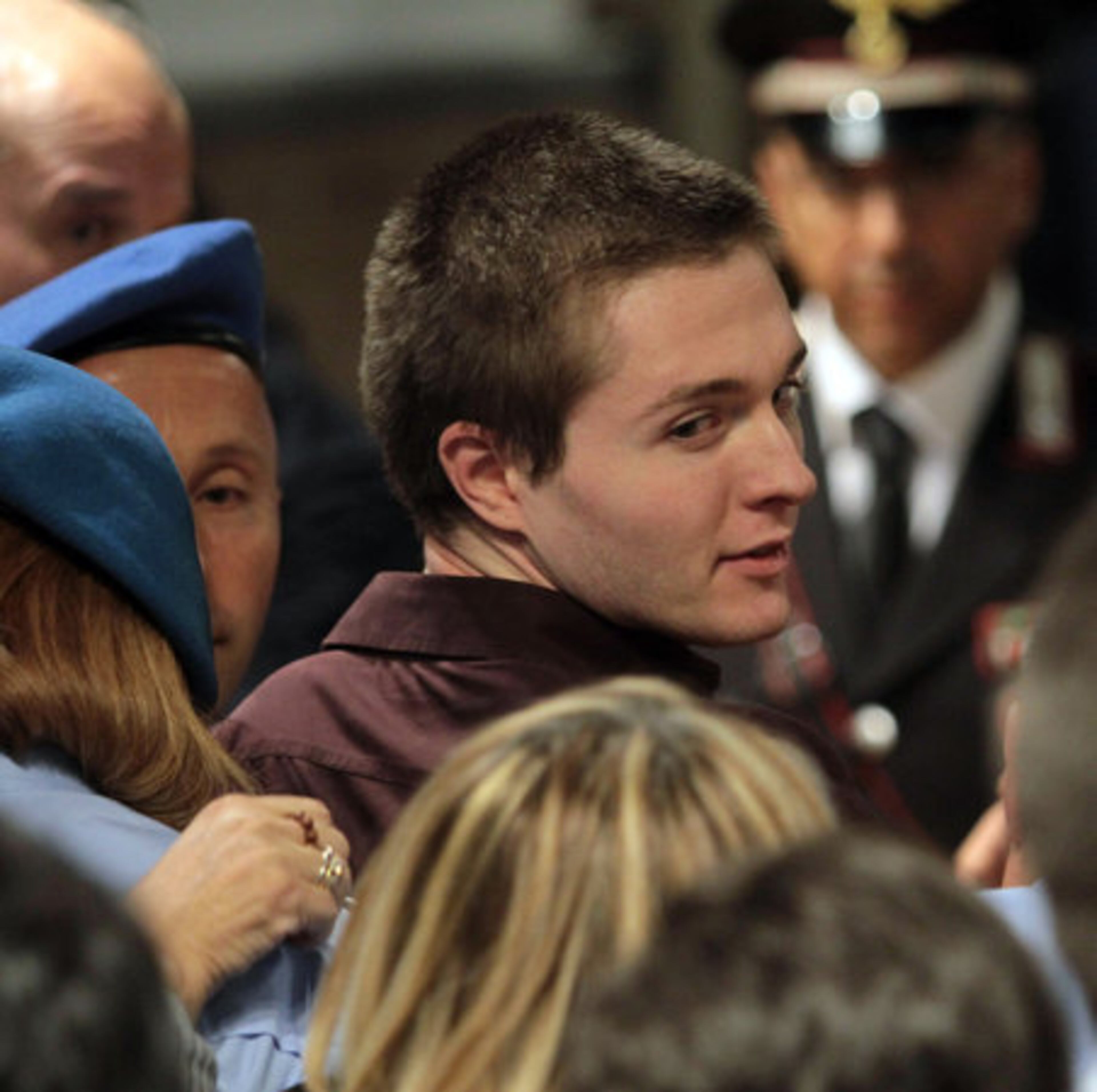 Raffaele Sollecito reacts following the verdict that overturns his conviction and acquits him of murdering his British roomate Meredith Kercher, at the Perugia court, Italy, Monday Oct. 3, 2011.