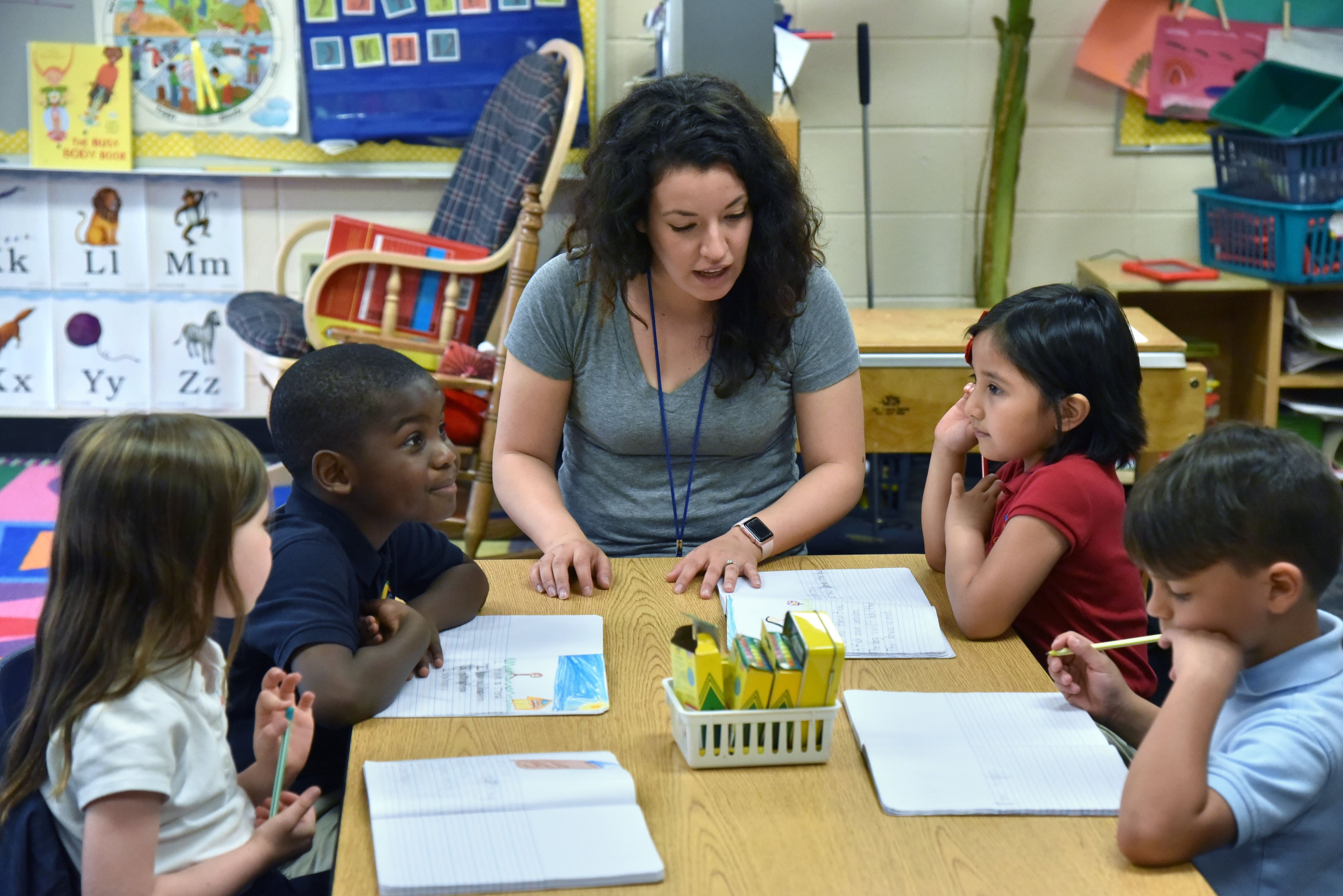 April 12, 2017 Marietta - Kindergarten teacher Ashley Wade teaches her students (from left) Eden Sterling, Adam Ajayi, Ximena Benitez and Ian DeOliviera, all 6, at Carman Adventist School in Marietta on Wednesday, April 12, 2017. Just like Gwinnett County before it, Cobb County is on the cusp of becoming a majority-minority county. This seems unthinkable in a county once dominated by the nationally notorious white supremacist, J.B. Stoner, the Kennesaw ordinance that required gun ownership, the county commission resolution that condemned the "gay lifestyle." But Cobb is a-changin. HYOSUB SHIN / HSHIN@AJC.COM