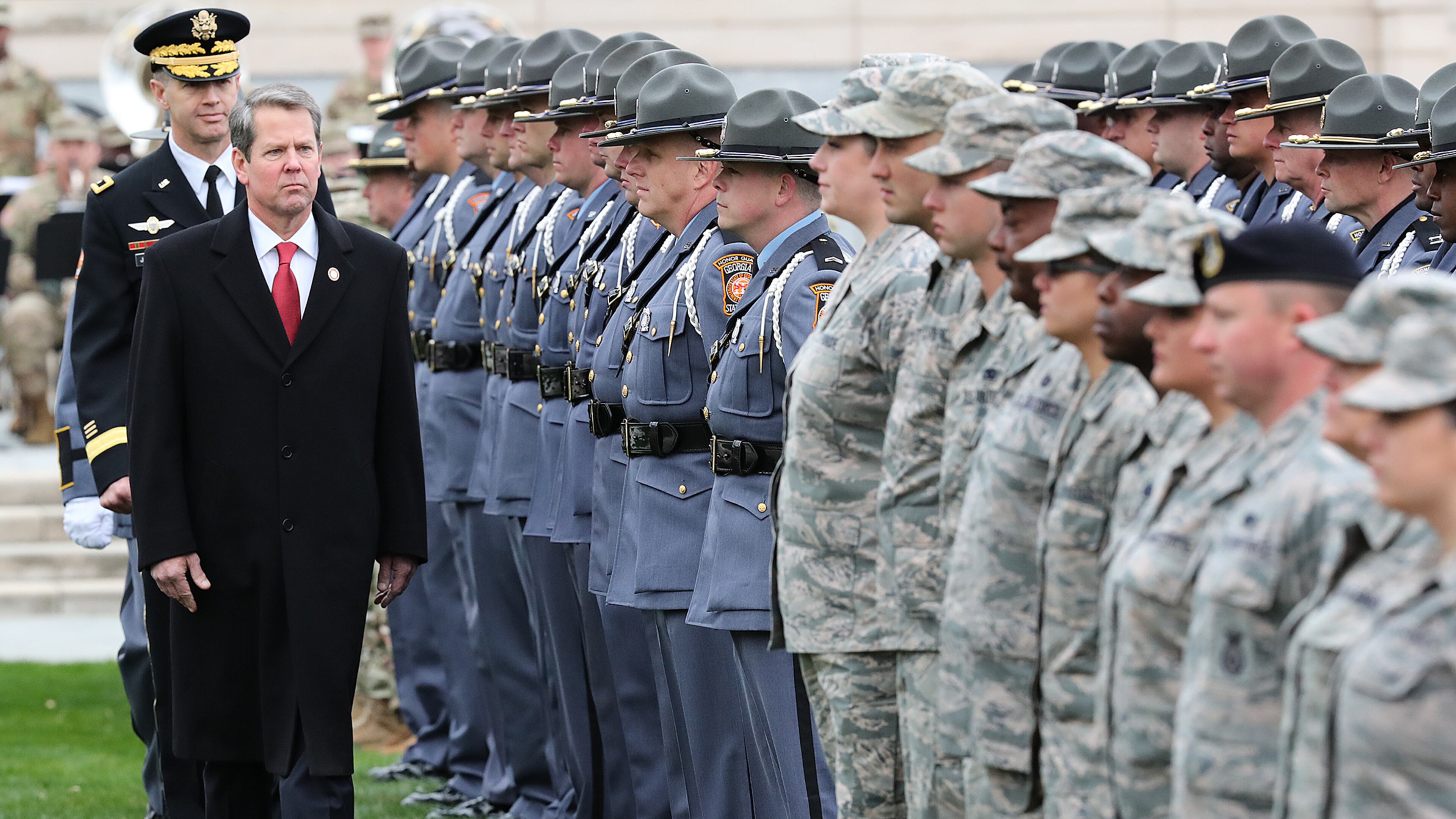 Gov. Brian Kemp reviews the Guard troops at Liberty Plaza, Atlanta, after he was sworn in on Monday, Jan. 14, 2019. He framed the decision to deploy troops to D.C. as a show of solidarity with Trump’s mission to “ensure the security and beauty of our nation’s capital.” (Curtis Compton/AJC)