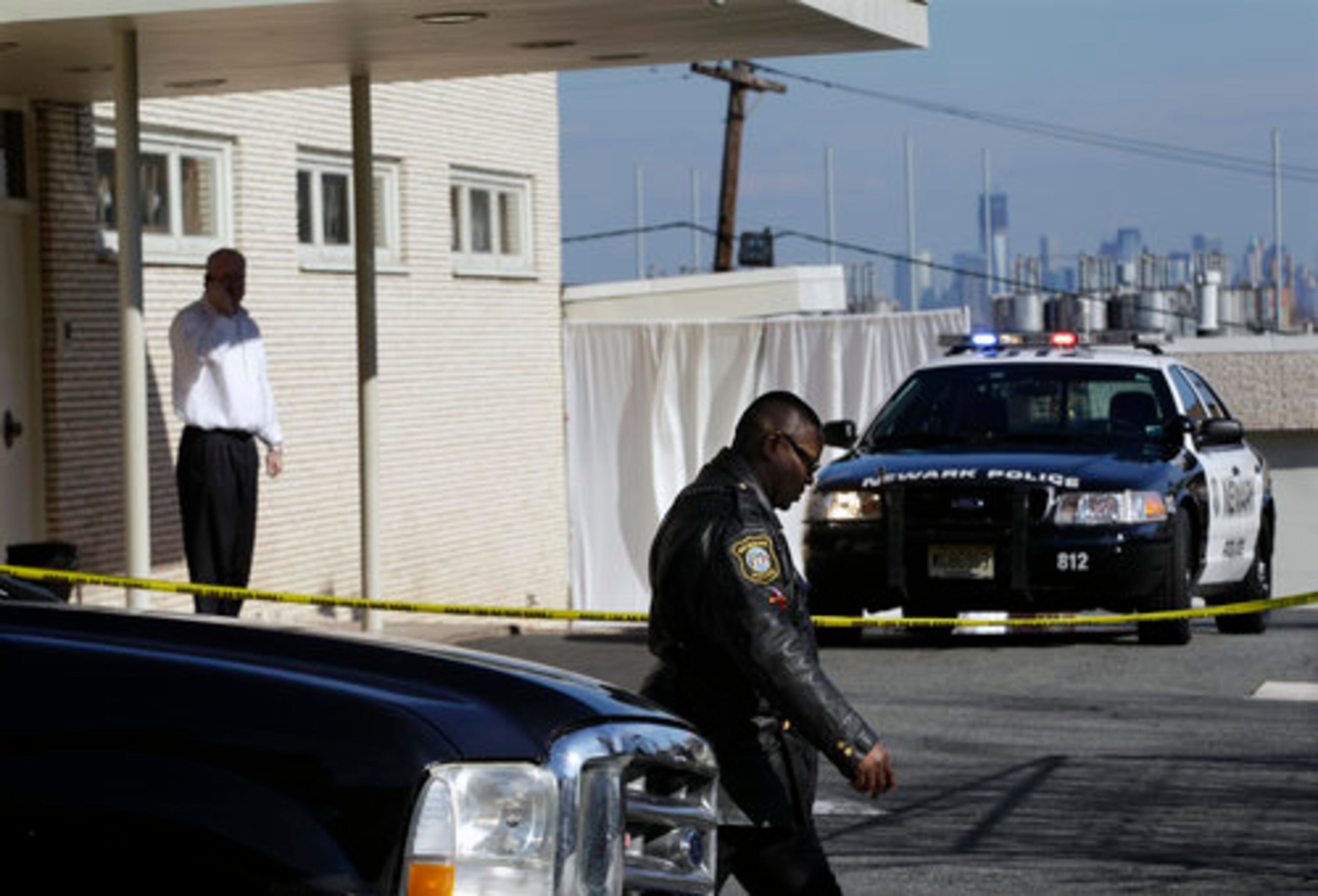 Police are seen near a curtained-off entrance at the Whigham Funeral Home in Newark, N.J., Friday, Feb. 17, 2012, where a viewing for Whitney Houston was held Friday.