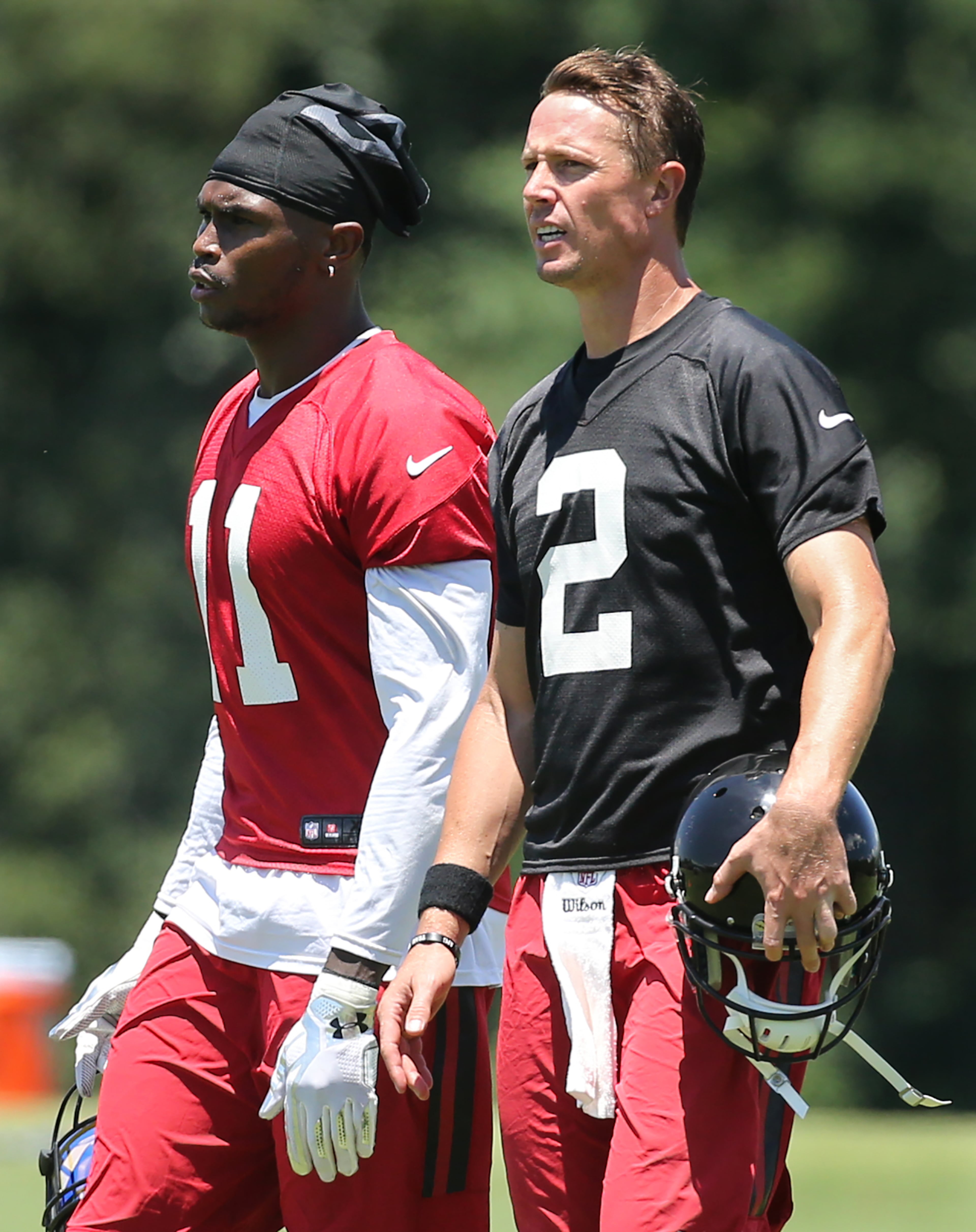 Matt Ryan and Julio Jones conger during an OTA day on Tuesday, June 7, 2016, in Flowery Branch. Curtis Compton / ccompton@ajc.com