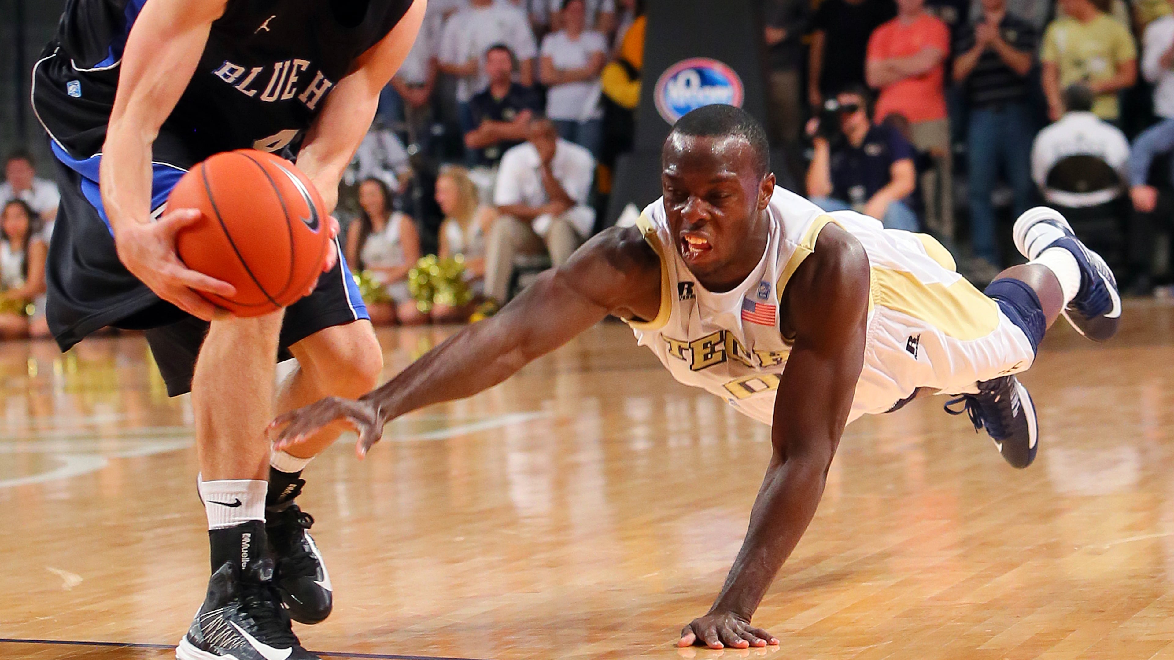 Georgia Tech guard Mfon Udofia dives for a lose ball that is snatched away by Presbyterian guard Austin Anderson during 2nd half action at McCamish Pavilion in Atlanta on Wednesday, Nov. 14, 2012. CURTIS COMPTON / CCOMPTON@AJC.COM