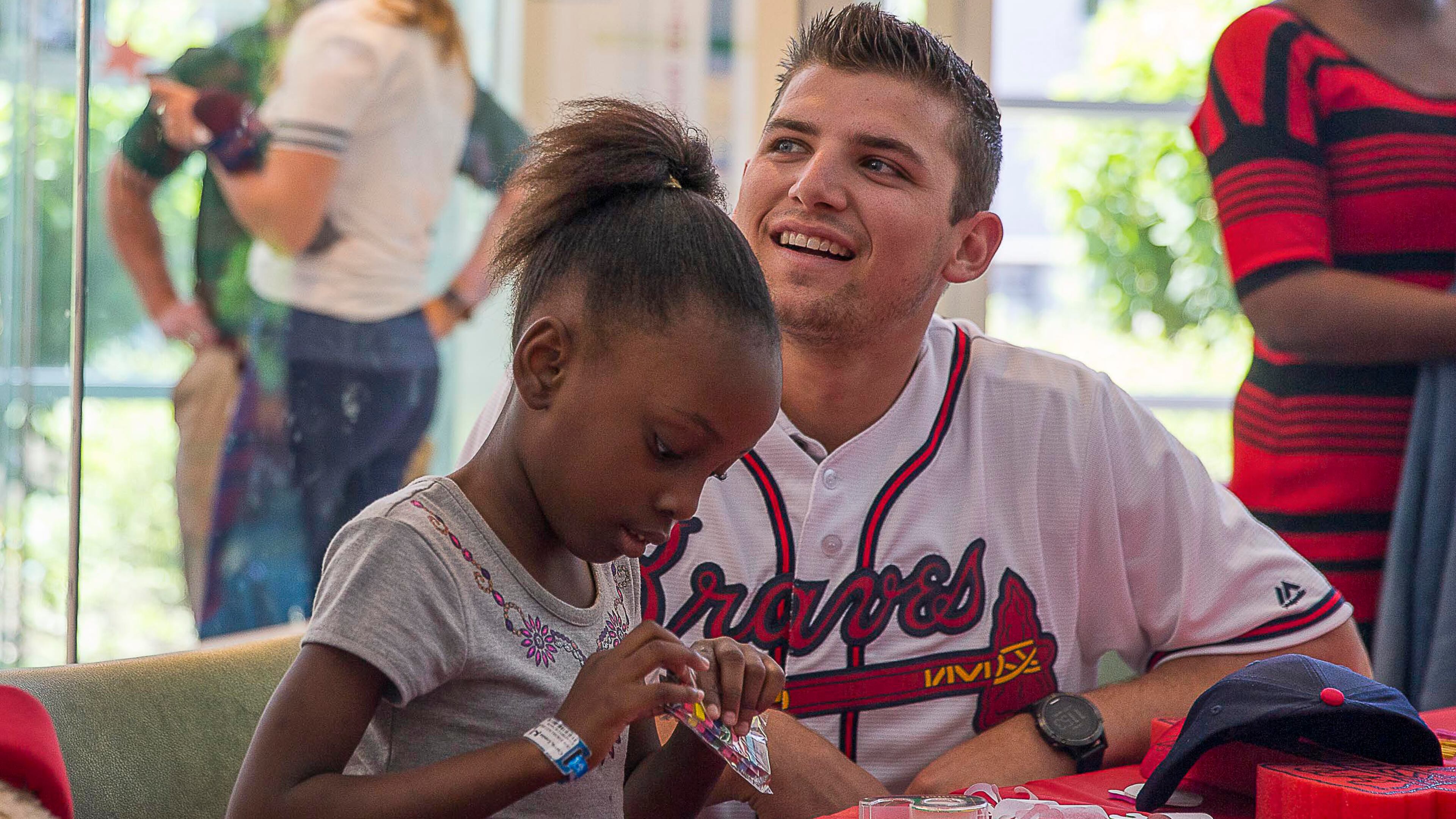 Atlanta Braves third basemen Austin Riley helps Lundan Currie with an arts and crafts project during the Braves' visit Tuesday, May 28, 2019, to the Children's Healthcare of Atlanta at Egleston Hospital.