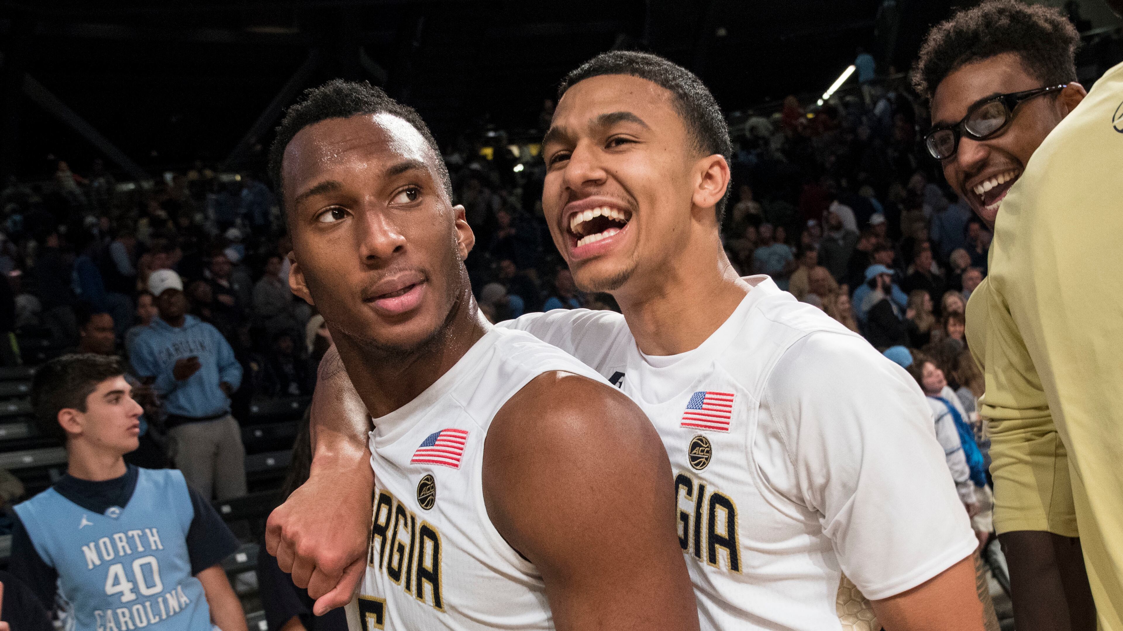 Georgia Tech's Justin Moore, right, celebrates with teammate Josh Okogie (5) after an NCAA college basketball game against North Carolina, Saturday, Dec 31, 2016, in Atlanta. Georgia Tech won 75-63. (AP Photo/John Amis)