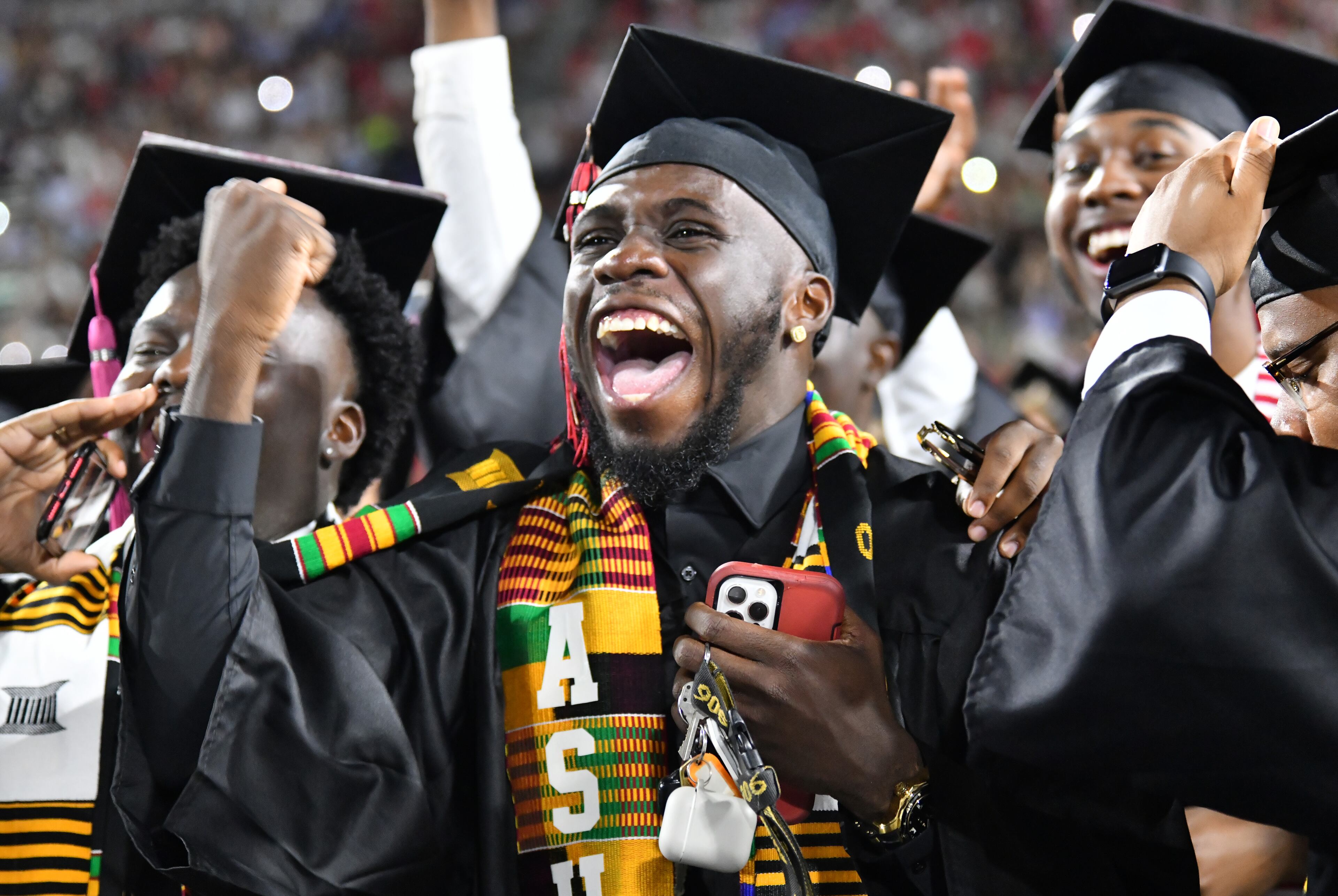 University of Georgia graduates react before they move their tassels during the 2022 Spring Undergraduate Commencement at Sanford Stadium in Athens on on Friday, May 13, 2022. (Hyosub Shin / Hyosub.Shin@ajc.com)