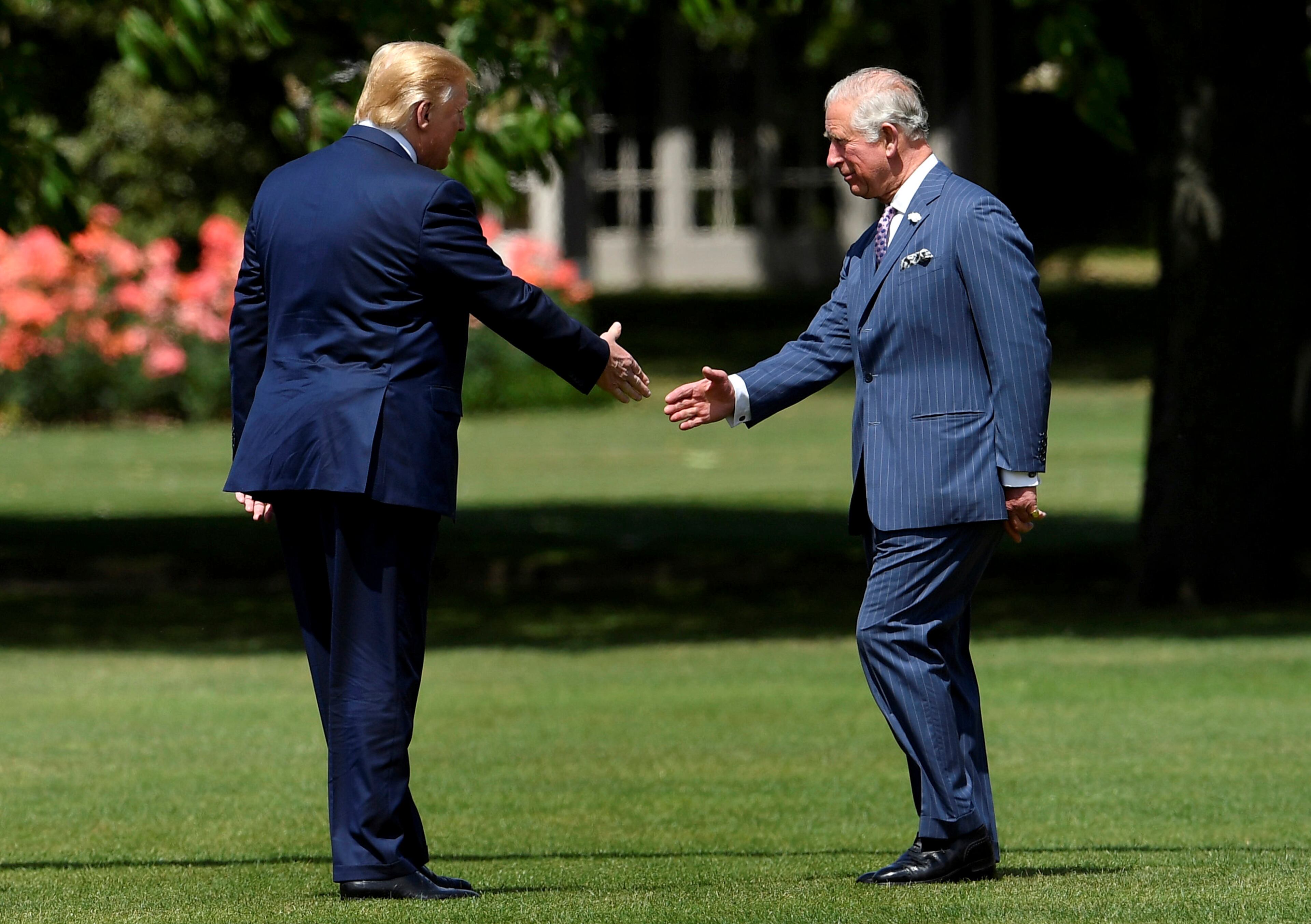 Britain's Prince Charles, right, meets U.S. President Donald Trump after he arrived at Buckingham Palace, in London, Monday, June 3, 2019. Trump is on a three-day state visit to Britain. (Toby Melville/Pool Photo via AP)