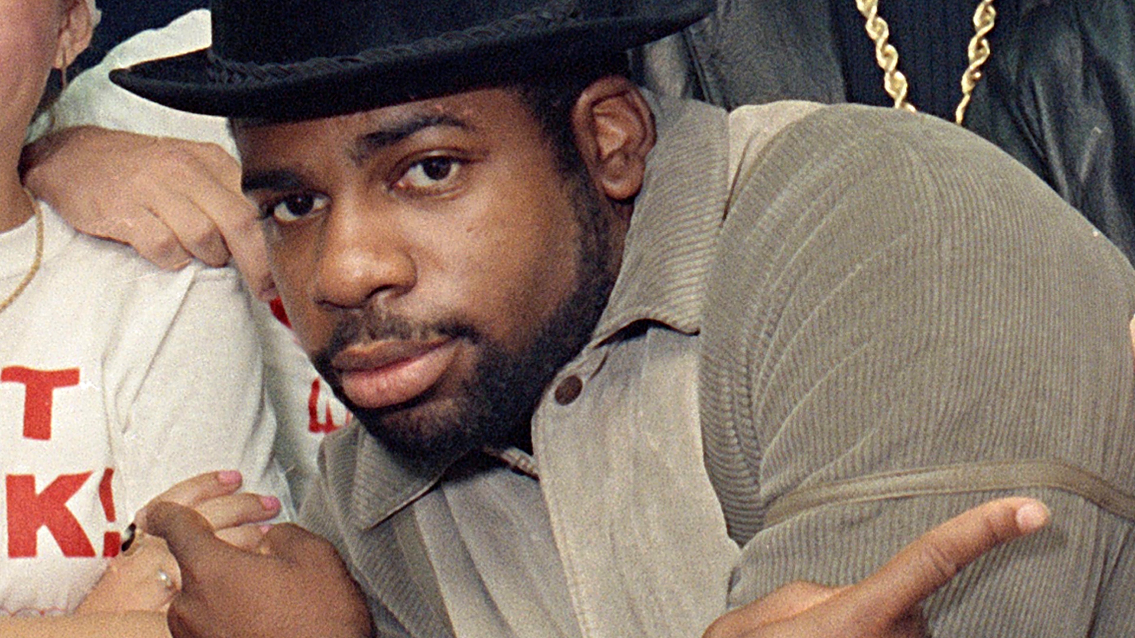 FILE -Run-D.M.C.'s Jason Mizell, Jam-Master Jay, poses with teenagers gathered at New York's Madison Square Garden, Oct. 7, 1986, in New York City. (AP Photo/G. Paul Burnett, File)