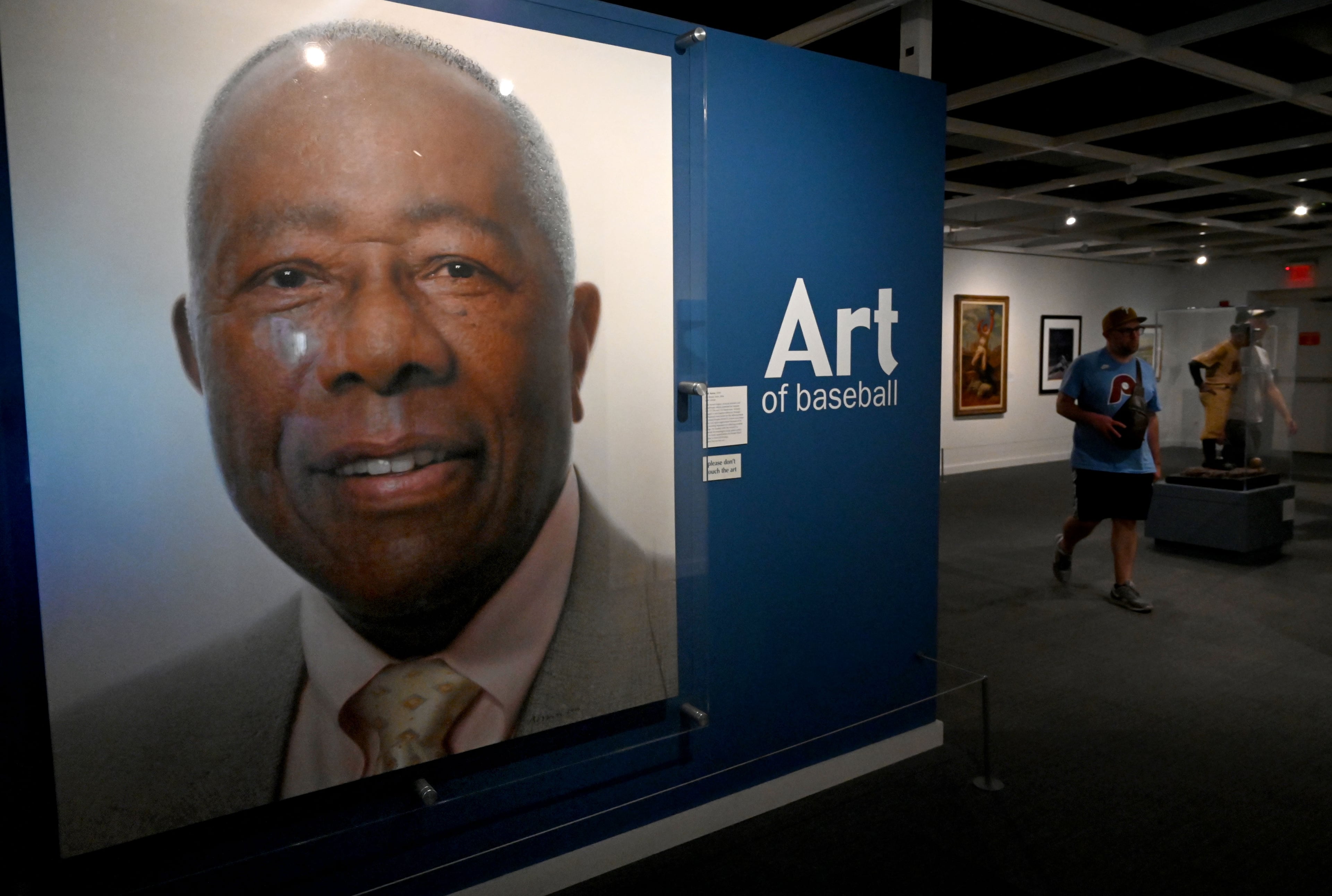 A portrait of Atlanta Braves legend Hank Aaron is displayed at the National Baseball Hall of Fame and Museum on Friday, July 24, 2026, in Cooperstown, N.Y. Andruw Jones will be inducted into the National Baseball Hall of Fame on Sunday as part of the Class of 2026, alongside Carlos Beltrán and Jeff Kent. He is recognized as one of the greatest center fielders in baseball history. Jones will become the 12th player with ties to the Atlanta Braves to be inducted into the Hall of Fame. (Hyosub Shin/AJC)