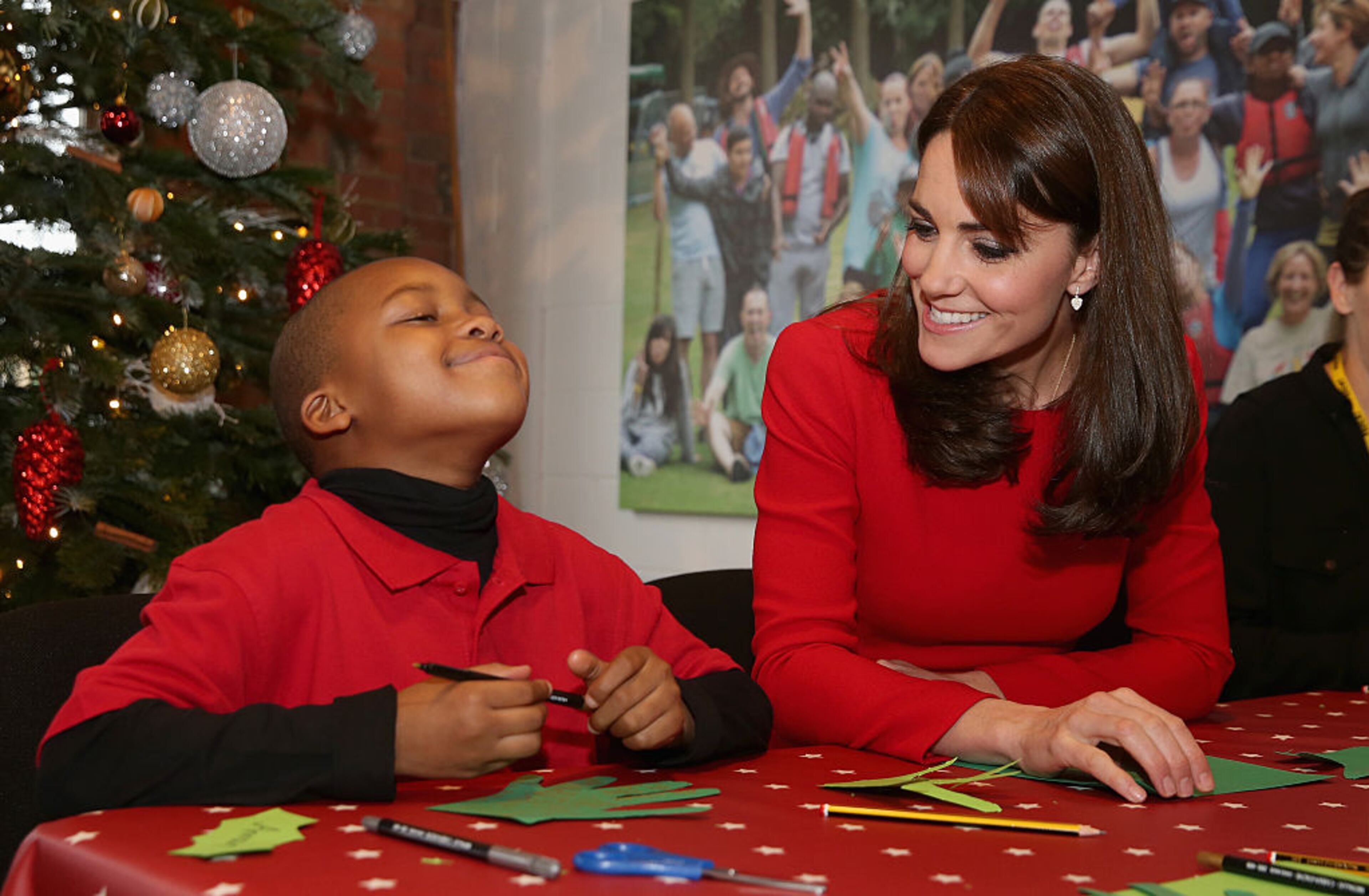 LONDON, ENGLAND - DECEMBER 15: Catherine, Duchess of Cambridge takes part in group activities as she attends the Anna Freud Centre Family School Christmas Party at Anna Freud Centre on December 15, 2015 in London, England. The Duchess joined groups of families in Festive activities designed to help pupils reflect on the positive progress in their social relationships and communication skills. (Photo by Chris Jackson - WPA Pool/Getty Images)