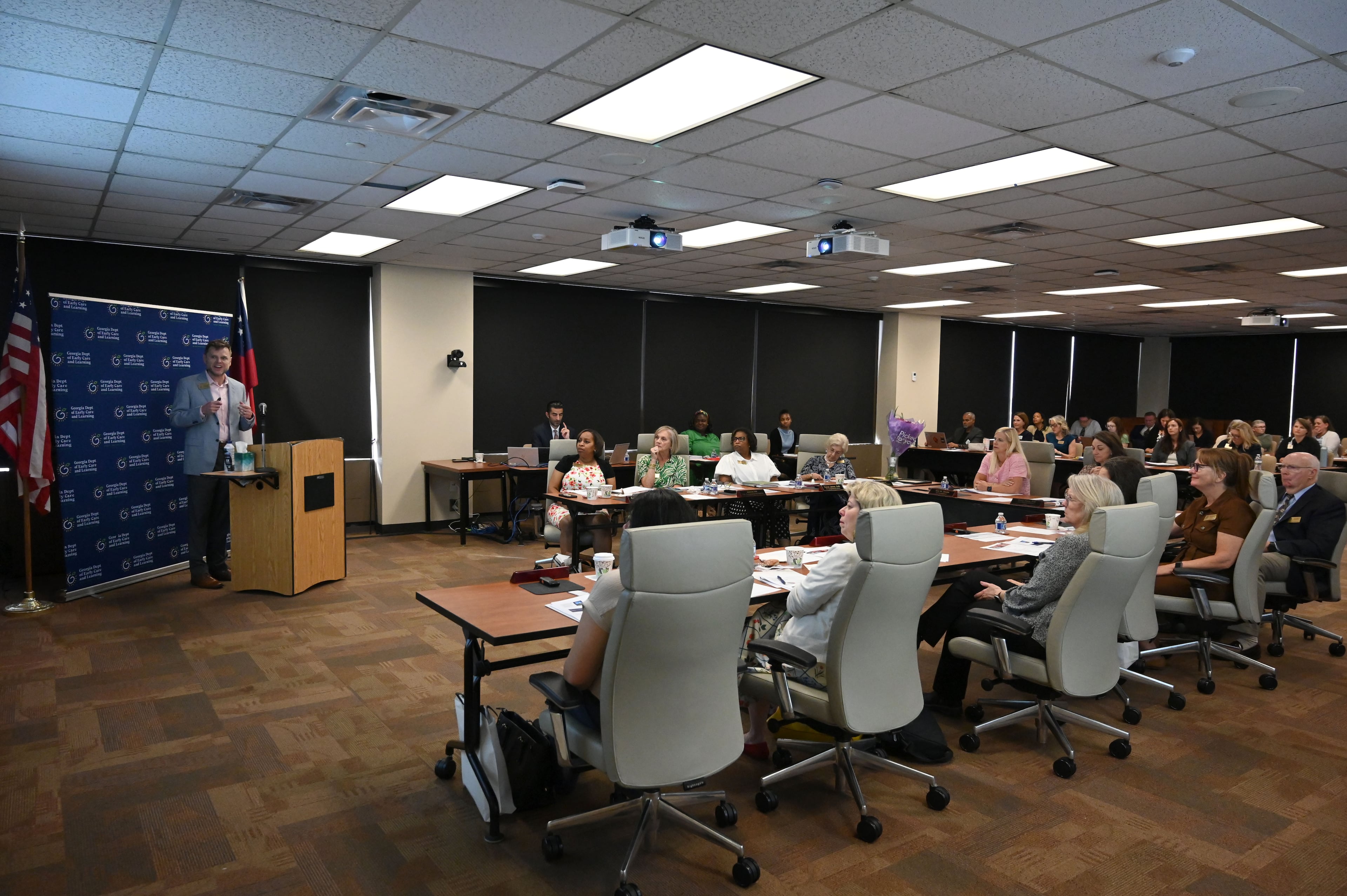Georgia Department of Early Care and Learning officials are seen here attending a recent board meeting. The state agency uses taxpayer-funded reimbursements and bonuses to incentivize daycares to pursue higher-quality care. (Hyosub Shin/AJC)