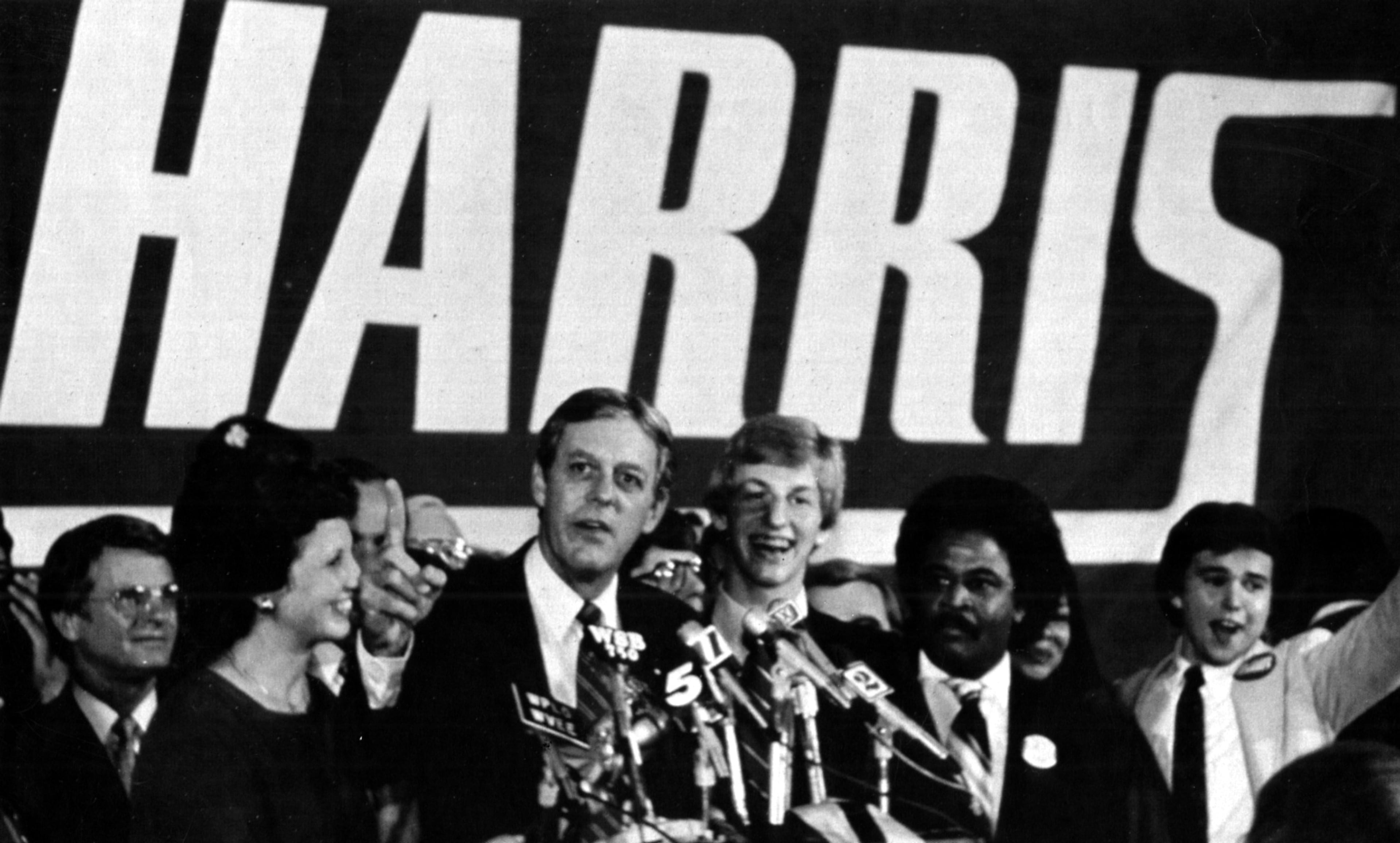 State Rep. Joe Frank Harris, flanked by his wife Elizabeth and son Joe Jr., addresses supporters at his victory party late Aug. 31, 1982, after he beat U.S. Rep. Bo Ginn for the Democratic nomination for governor. Rep. Tyrone Brooks, D-Atlanta (2nd from right), and Lt. Gov. Zell Miller (left) join the Harris family on stage. -- READ MORE: The latest on Brooks' case