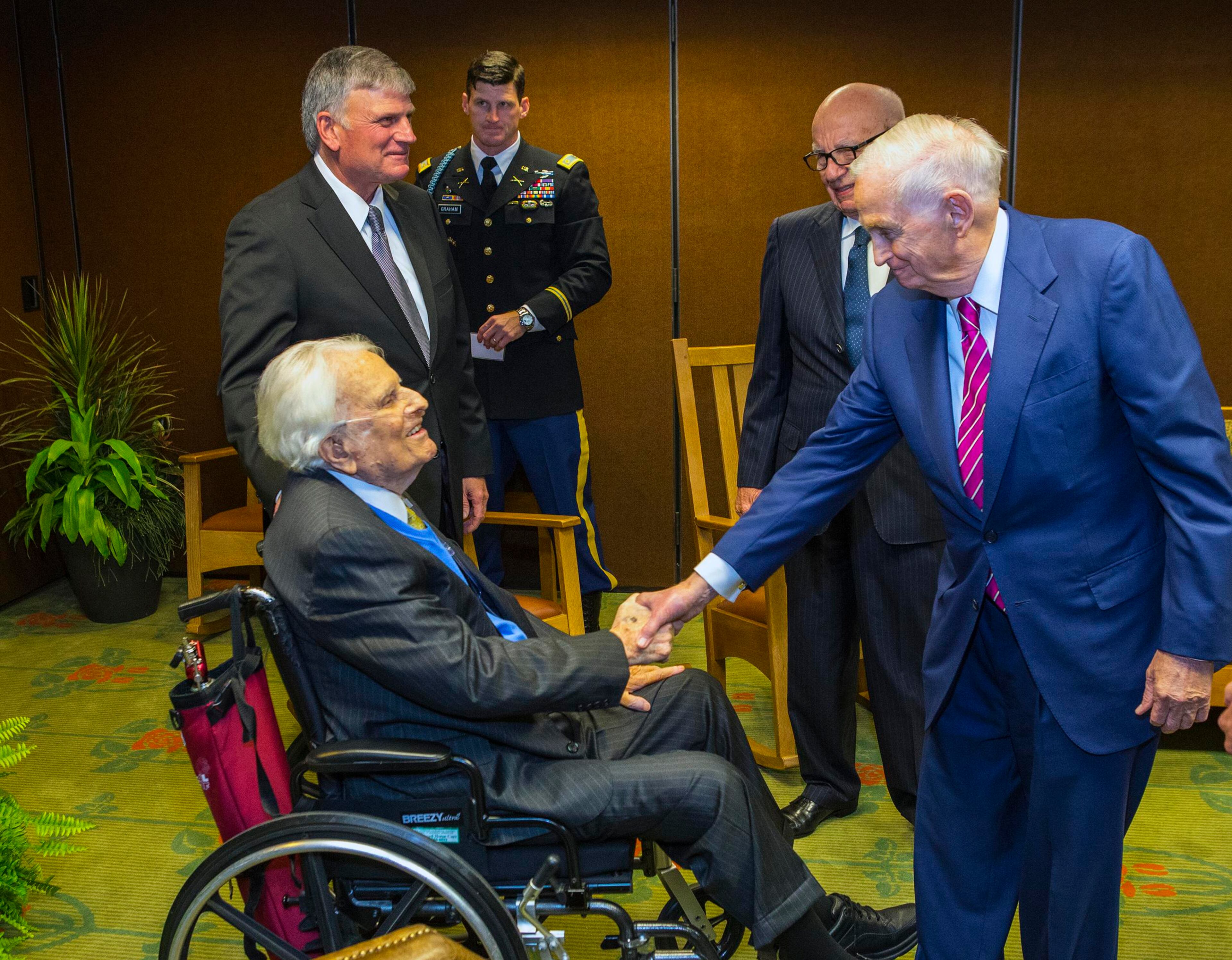 Billy Graham, Franklin Graham, Edward Graham, Rupert Murdoch, Bill Marriott, Jr. (L-R) talk at a celebration for Graham's 95th birthday in Asheville, North Carolina as seen in this handout courtesy of Billy Graham Evangelistic Association taken on November 7, 2013. REUTERS/Billy Graham Evangelistic Association/Handout via Reuters