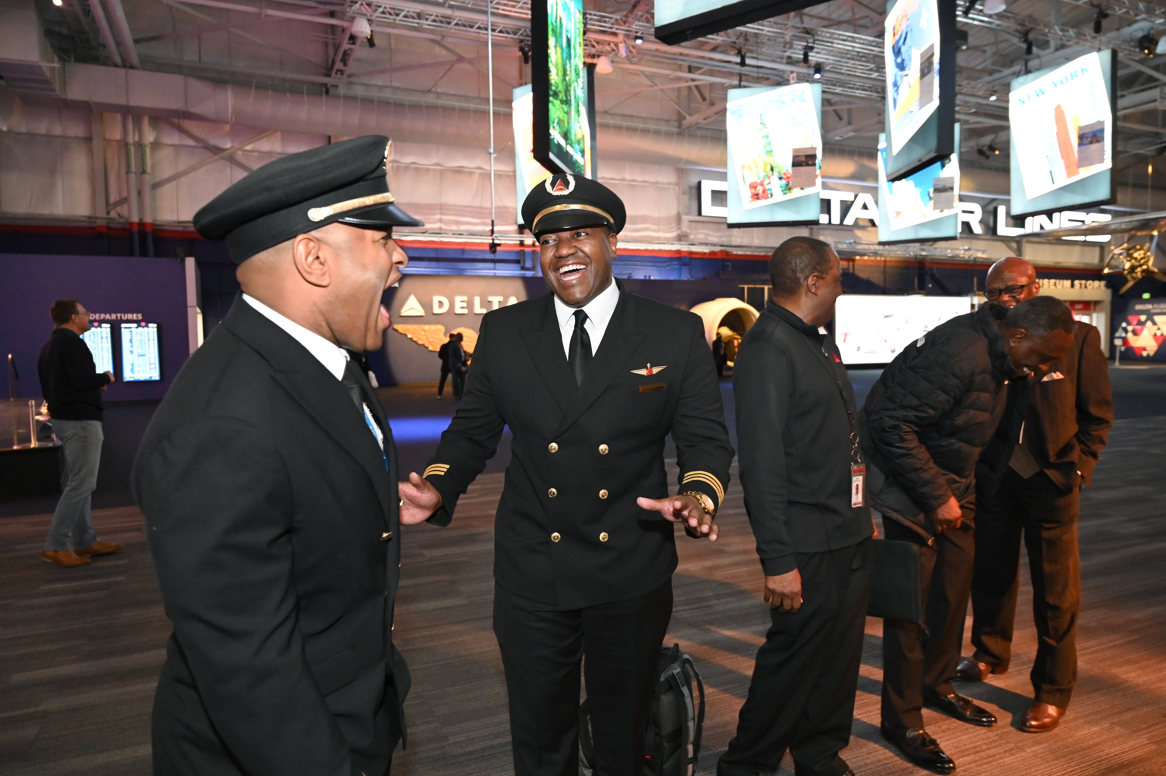 First officer Kyle Foley (left) and first officer Curtis Jackson chat at the Delta Flight Museum on Feb. 3, 2026. Foley was a student on the first Dream Flight and became a Delta pilot. (Hyosub Shin/AJC)
