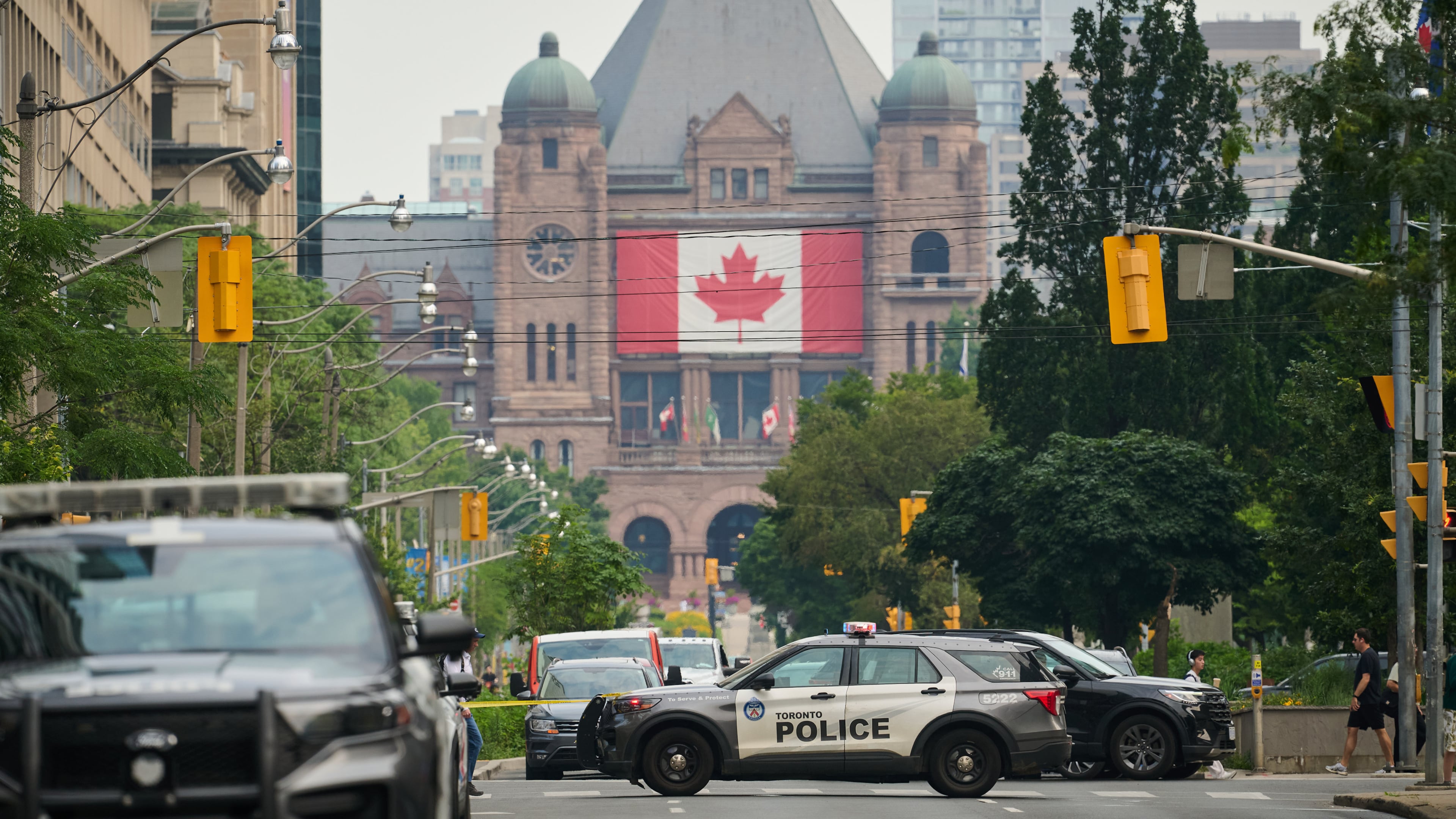 Police work the scene of an early morning shooting outside the US Consulate in Toronto, on Monday, July 27, 2026. (Sammy Kogan/The Canadian Press via AP)