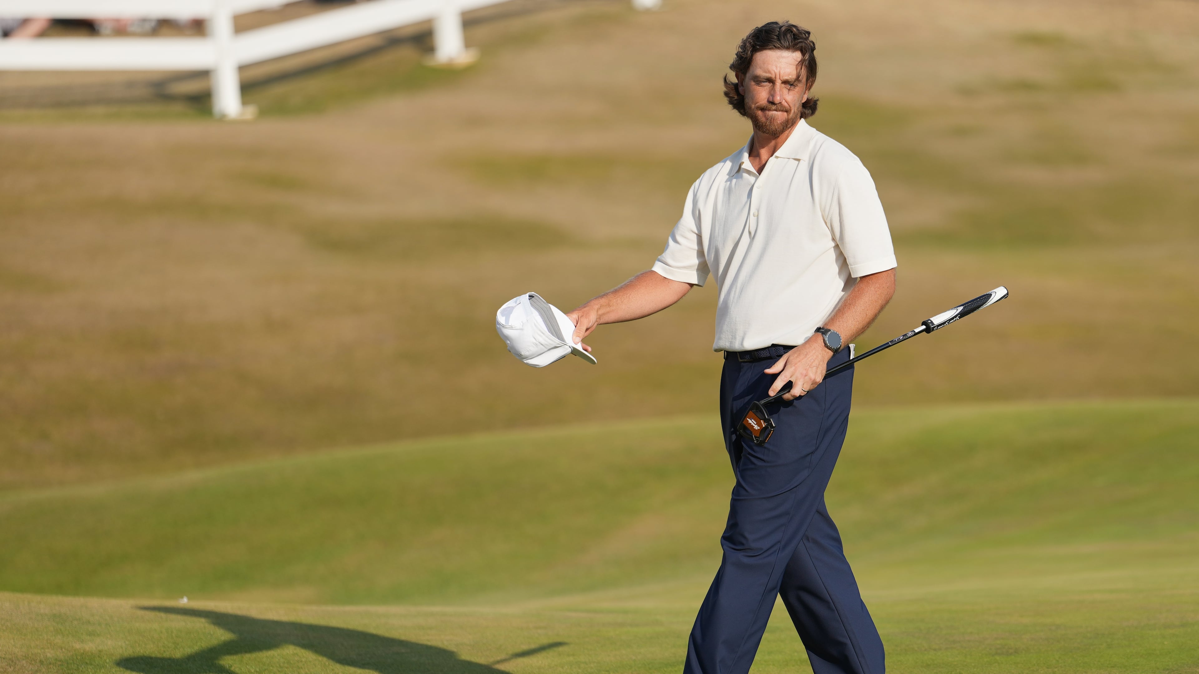 Tommy Fleetwood of England reacts to the crowd on the 18th green after completing his third round during the third day of the British Open Golf championships at Royal Birkdale golf club, in Southport, England, Saturday, July 18, 2026. (AP Photo/Jon Super)