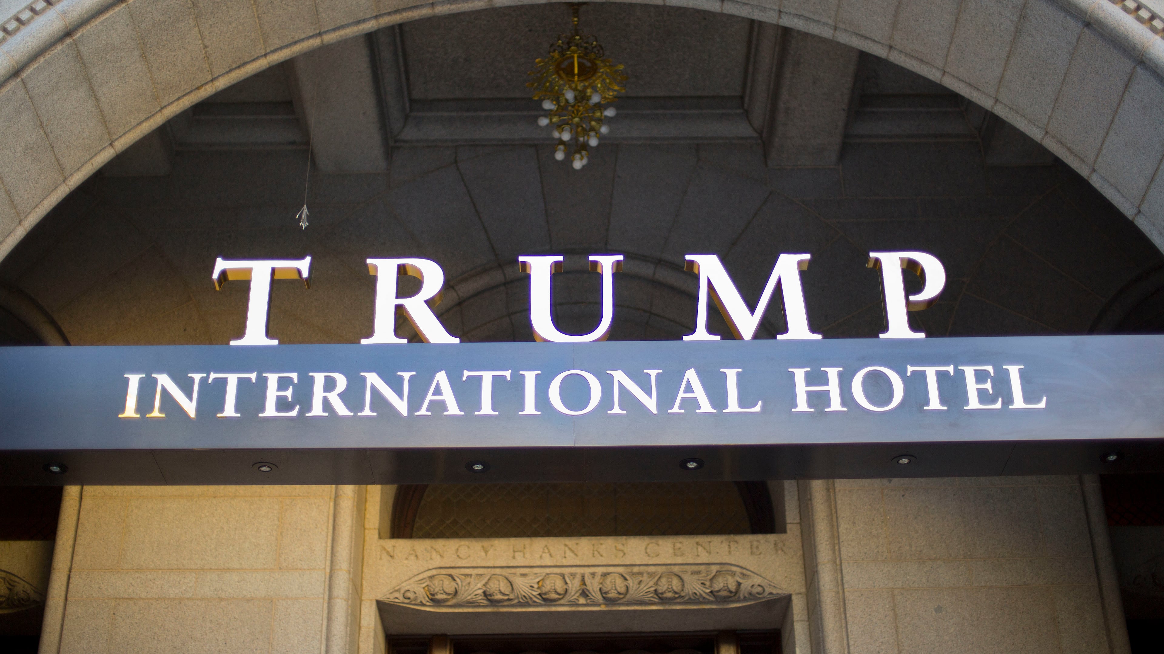 FILE - This Monday, Sept. 12, 2016, file photo, shows the exterior of the Trump International Hotel in downtown Washington. Experts on government ethics are warning President-elect Donald Trump that hell never shake suspicions of a clash between his private interests and the public good if he doesnt sell off his vast holdings, which include roughly 500 companies in more than a dozen countries. They say just the appearance of conflicts is likely to tie up the new administration in investigations, lawsuits and squabbles. (AP Photo/Pablo Martinez Monsivais, File)