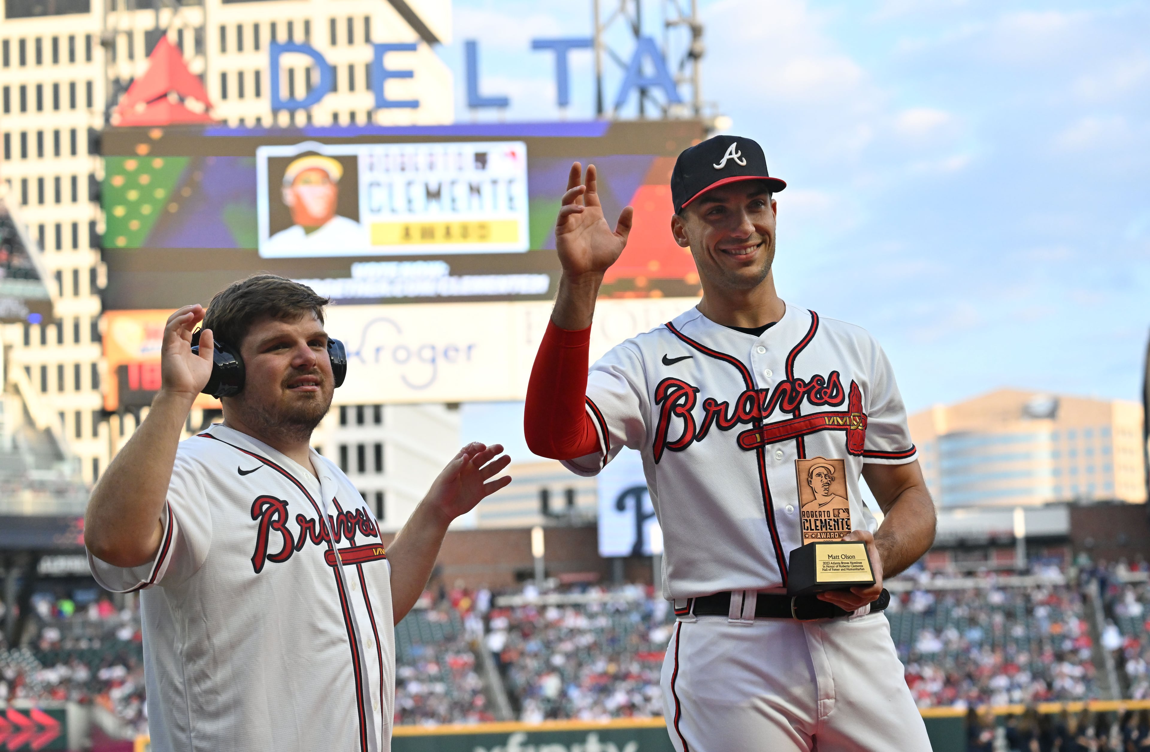 Atlanta Braves first baseman Matt Olson, with friend Reece Blankenship, who has nonverbal autism, is recognized as a Roberto Clemente Award nominee during a pregame ceremony. (Hyosub Shin / Hyosub.Shin@ajc.com)
