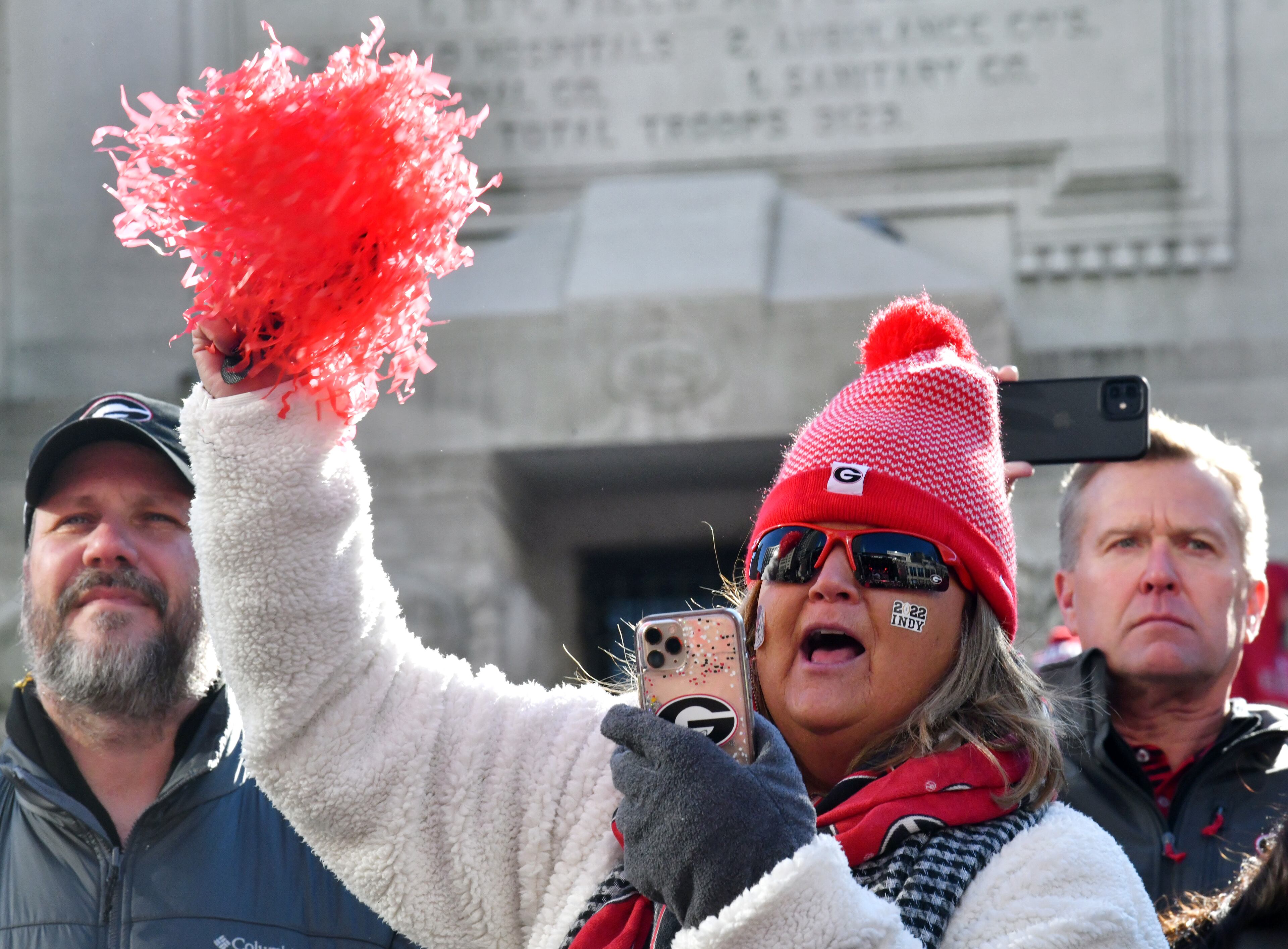 Georgia fan cheers as Georgia Redcoat Marching Band performs during Allstate Championship Tailgate event at Monument Circle prior to the 2022 College Football Playoff National Championship Game at Lucas Oil Stadium in Indianapolis on Monday, January 10, 2022. (Hyosub Shin / Hyosub.Shin@ajc.com)