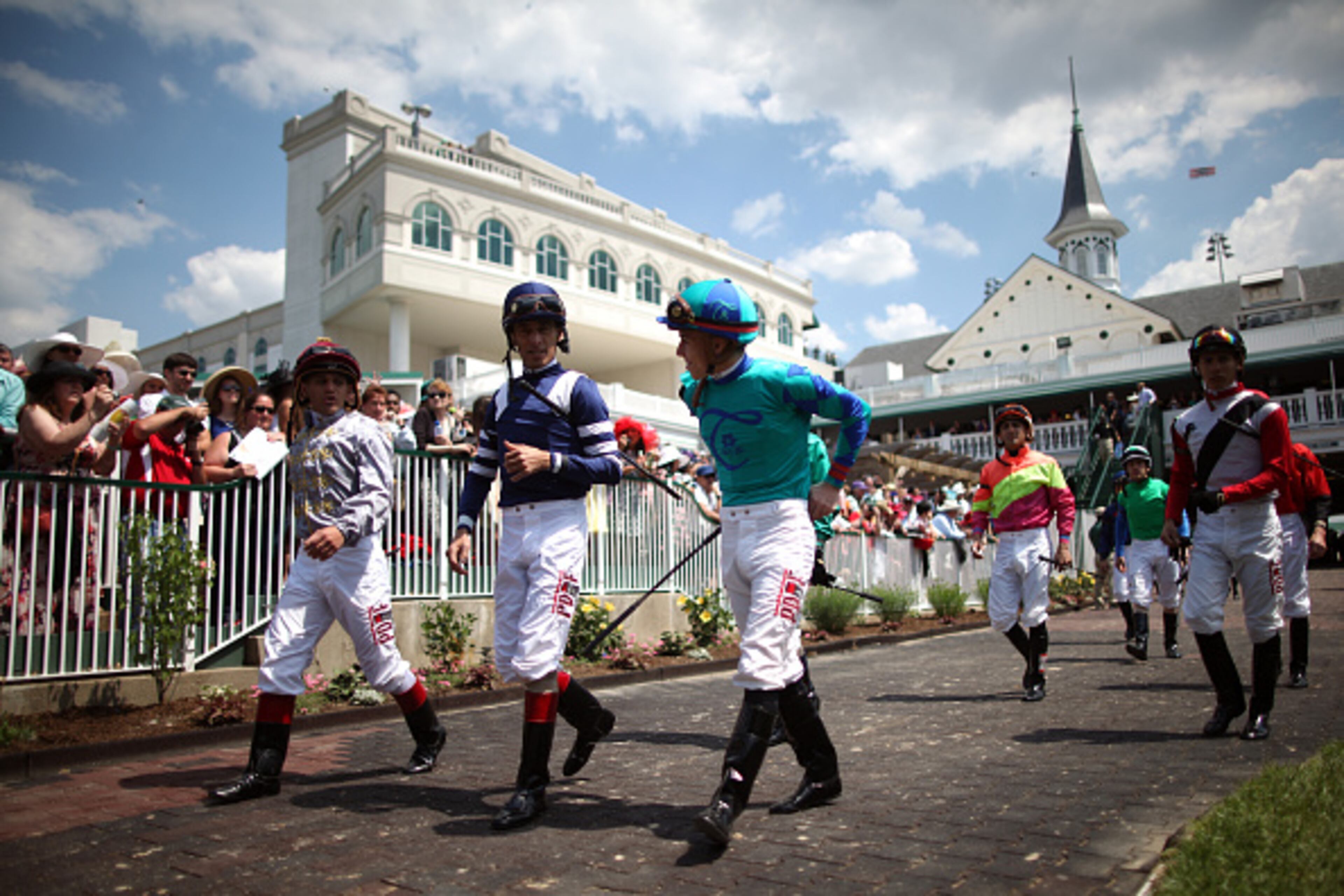 LOUISVILLE, KY - MAY 02: Jockeys walk in the paddock area prior to the 141st running of the Kentucky Derby at Churchill Downs on May 2, 2015 in Louisville, Kentucky. (Photo by Chris Graythen/Getty Images)
