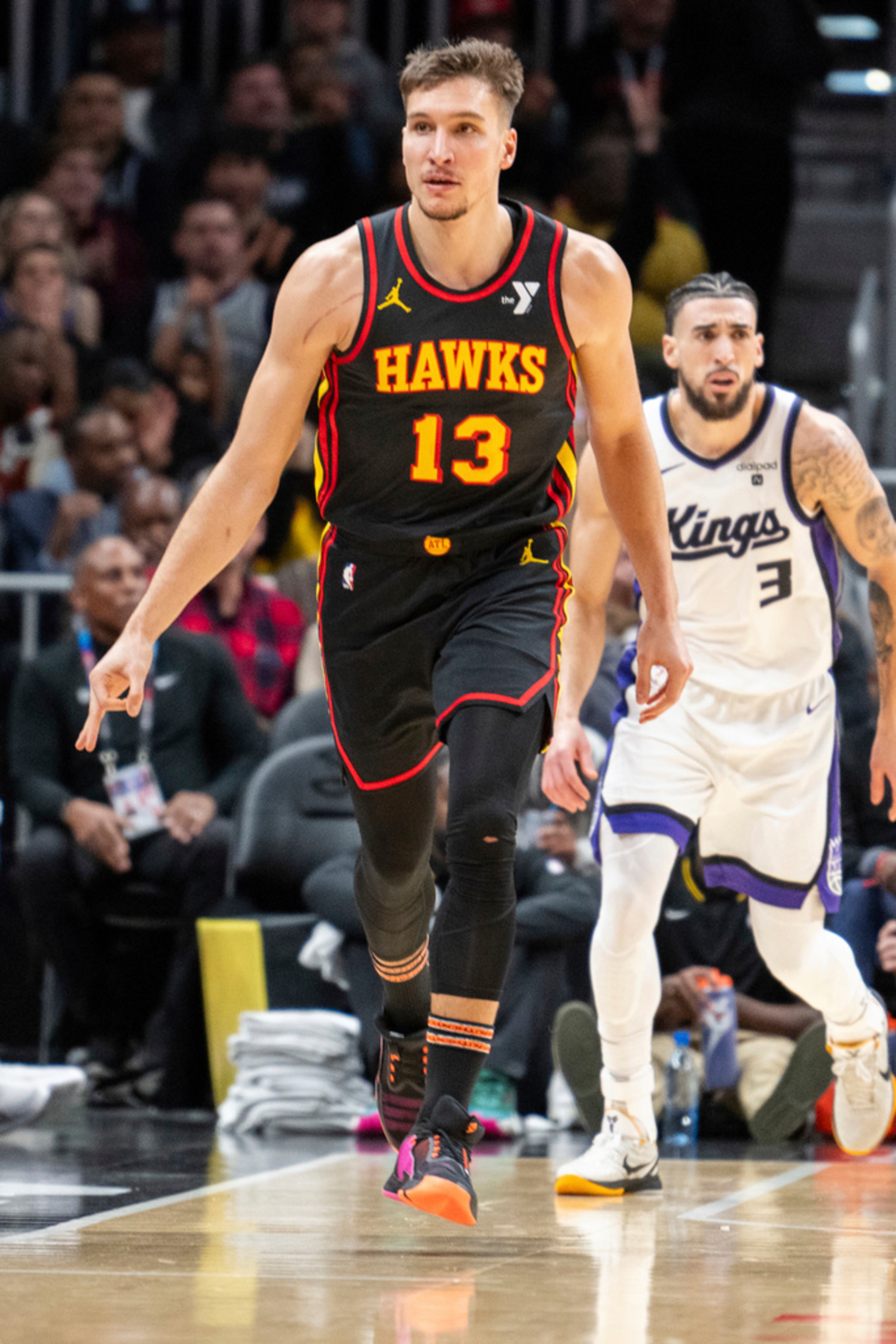 Atlanta Hawks guard Bogdan Bogdanovic (13) reacts after making a 3-point basket during the second half of an NBA basketball game against the Sacramento Kings, Friday, Dec 29, 2023, in Atlanta. (AP Photo/Hakim Wright Sr.)