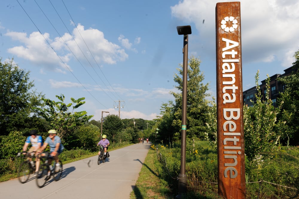 Bikers ride along the Atlanta Beltline Southwest Trail in June. That month a ribbon-cutting ceremony celebrated the completion of the longest continuous trail in the Atlanta Beltline. (AJC)