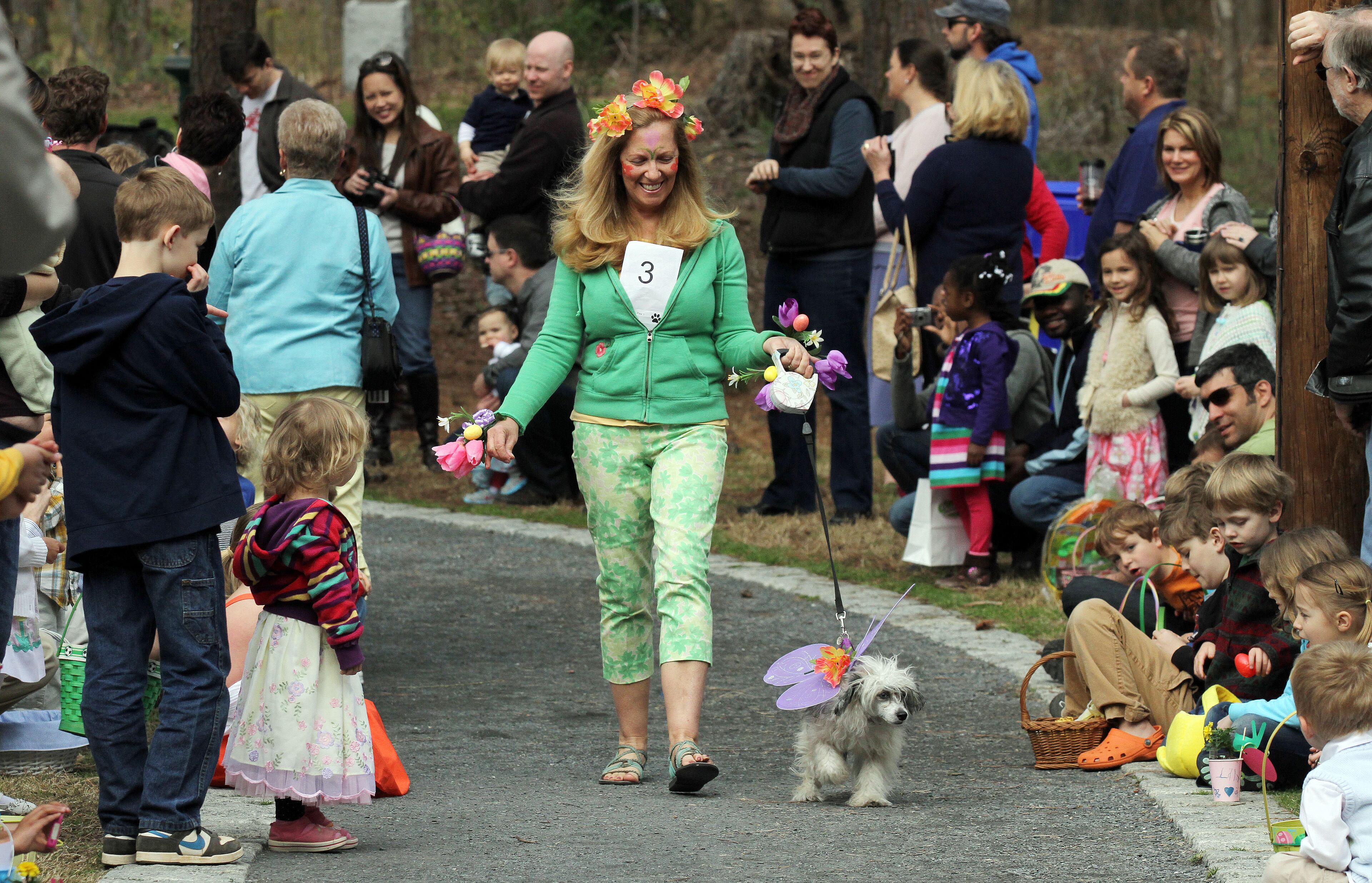 Melissa O'Shields walks her dog Beauty Bao Bridges during the City of Avondale Estates Annual Dog Parade at the Community Club on Lake Avondale on Sat. March 30th, 2013.