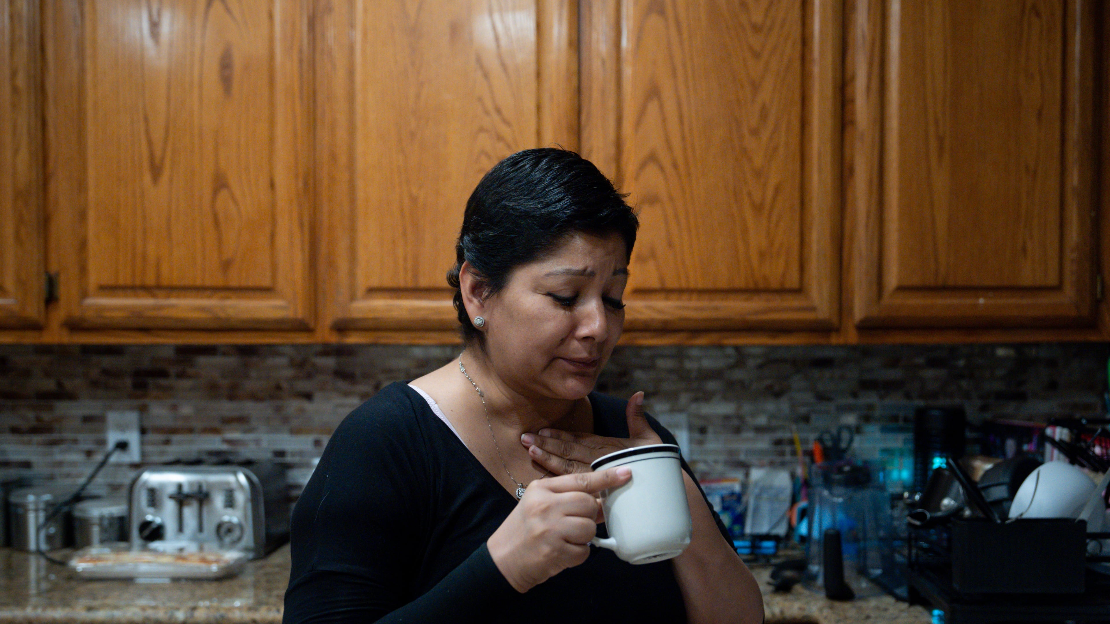 Cindy Banda drinks a home remedy after experiencing side effects from the targeted therapy pill Kisqali, Sept. 16, 2026, at her house in McAllen, Texas. (AP Photo/Julia Demaree Nikhinson)