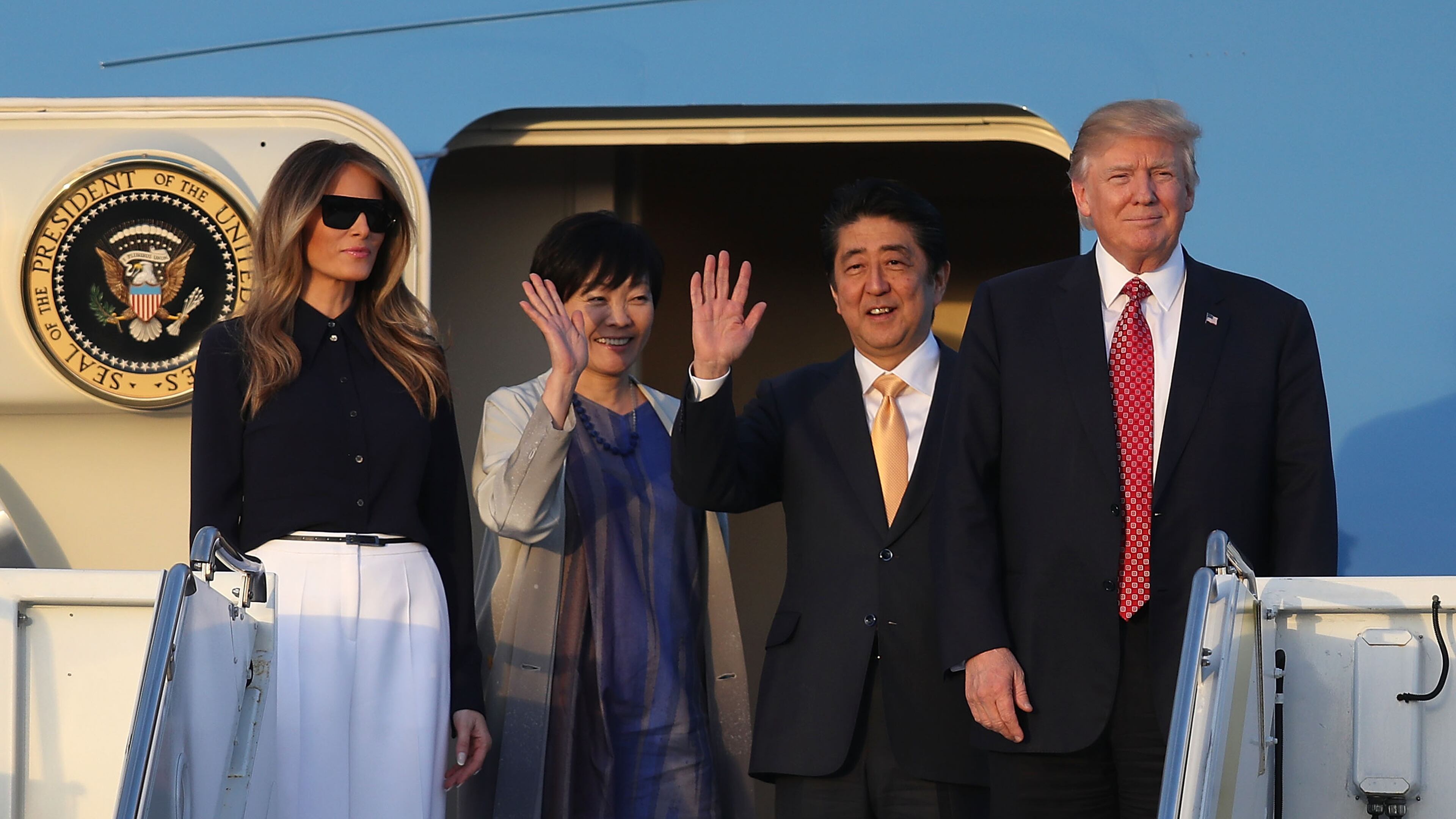 WEST PALM BEACH, FL - FEBRUARY 10: President Donald Trump and his wife Melania Trump arrive with Japanese Prime Minister Shinzo Abe and his wife Akie Abe on Air Force One at the Palm Beach International airport as they prepare to spend part of the weekend together at Mar-a-Lago resort on February 10, 2017 in West Palm Beach, Florida. The two are scheduled to get in a game of golf as well as discuss trade issues. (Photo by Joe Raedle/Getty Images)