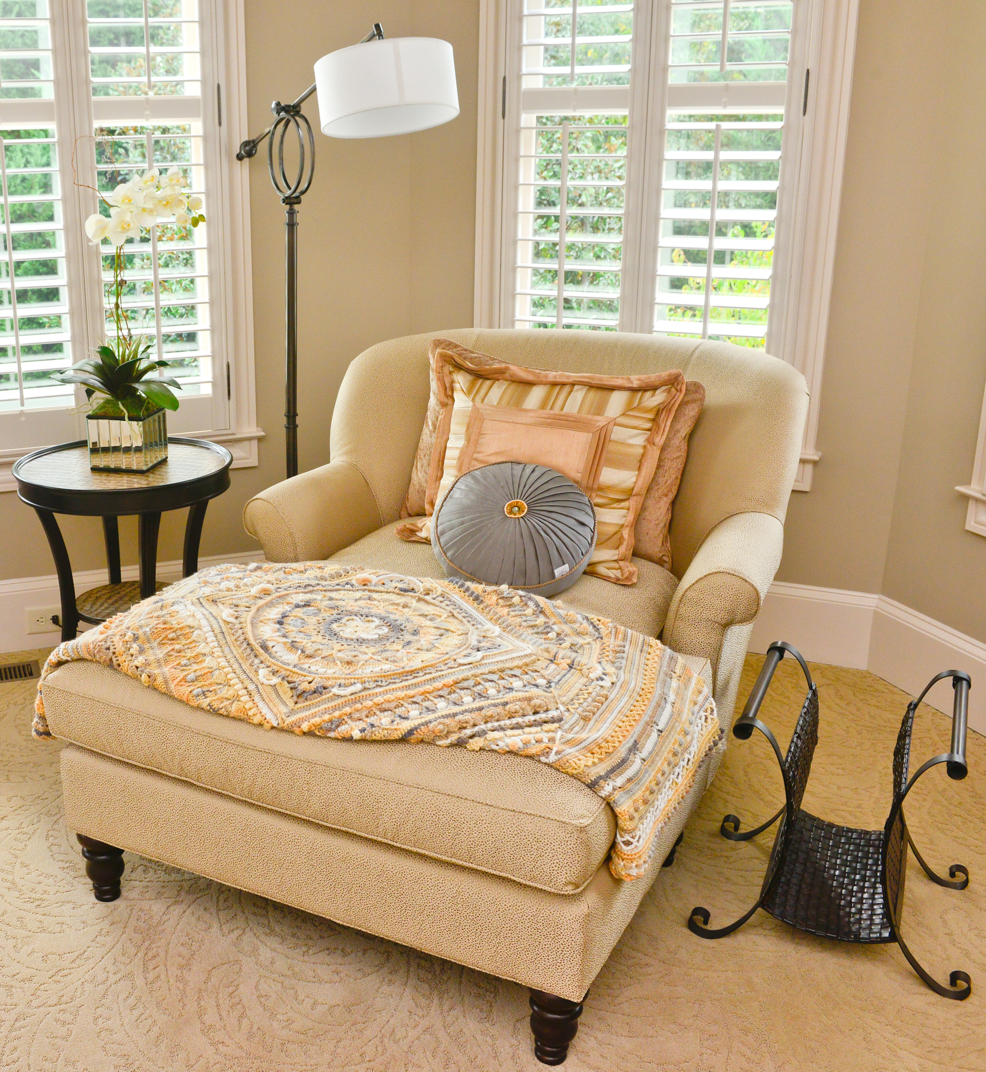 A chaise from Highland House Furniture and with a place to put a drink or a book on the side table from Hooker Furniture, form a relaxing sitting area for Kelsey and Schenck Wiley.