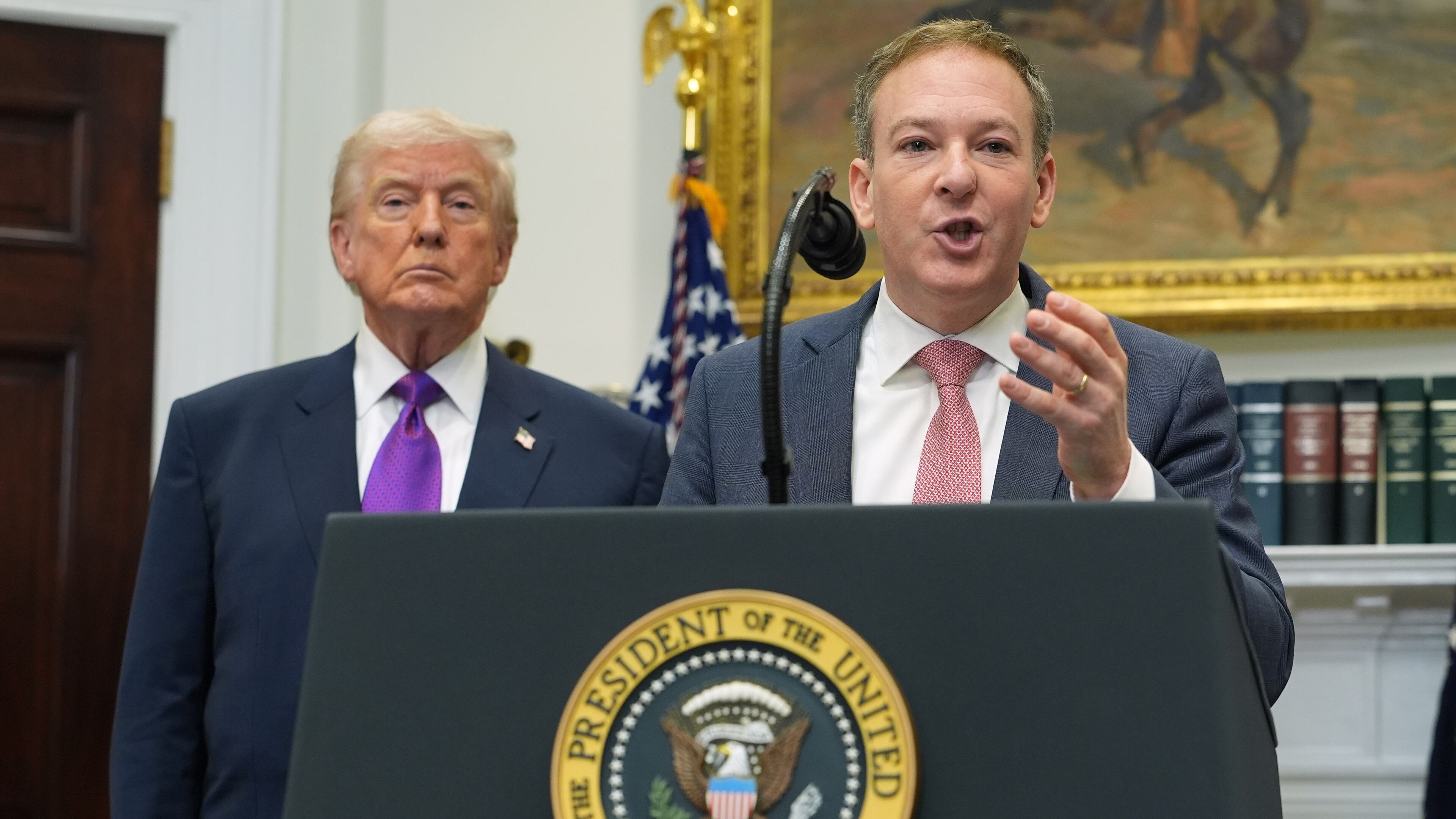 President Donald Trump listens as Environmental Protection Agency director Lee Zeldin speaks during an event announcing that the EPA will no longer regulate greenhouse gases, in the Roosevelt Room of the White House, Thursday, Feb. 12, 2026, in Washington. (AP Photo/Evan Vucci)