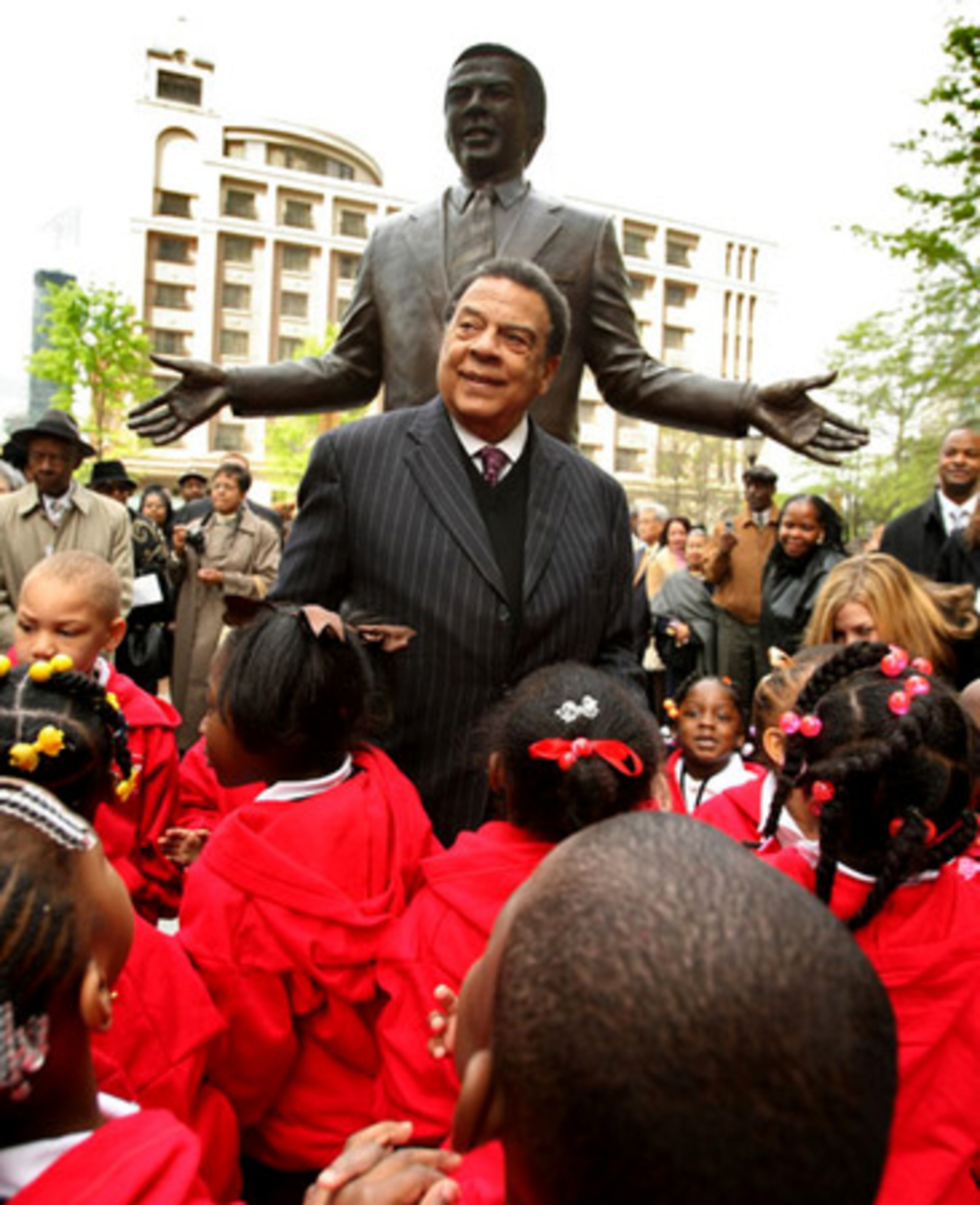 Former Atlanta Mayor Andrew Young and children from the Andrew and Walter Young Family YMCA pre-school unveil a downtown statue in his honor on Monday. About 200 people attended the dedication at Walton Spring Park, which highlights the story of Young's life and his contributions to Atlanta, the U.S. and the world as minister, civil rights leader, mayor, United Nations ambassador and Olympic visionary.