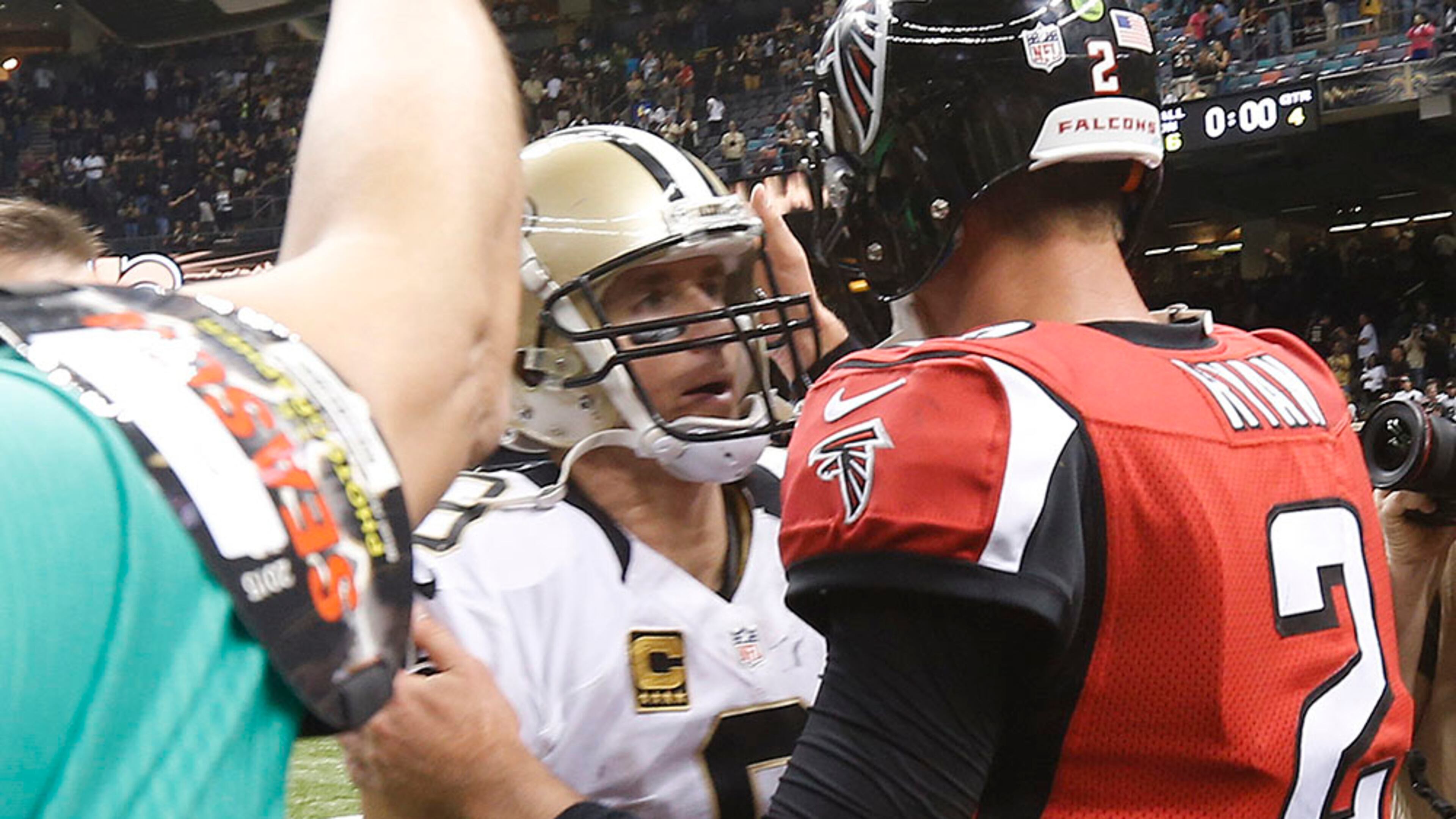 New Orleans Saints quarterback Drew Brees (9) speaks with Atlanta Falcons quarterback Matt Ryan (2) after the second half of an NFL football game, Thursday, Oct. 15, 2015, in New Orleans. The New Orleans Saints won 31-21. (AP Photo/Gerald Herbert)