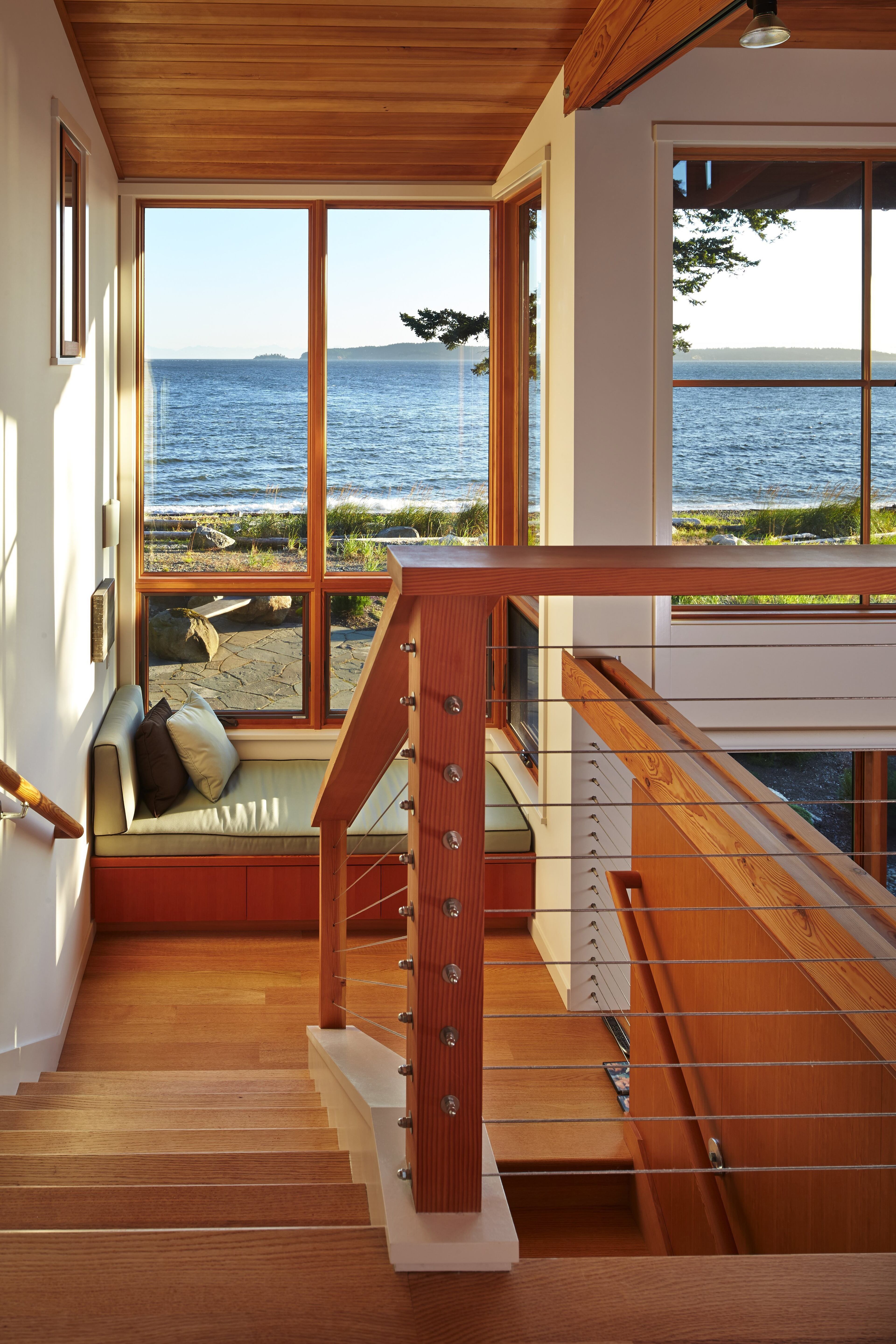 Window seats throughout the home offer many places to curl up. Plus, says Richard Boone, "There's always something to watch." They can see the lights of Vancouver, B.C., in the evenings. (Benjamin Benschneider/Seattle Times/MCT)